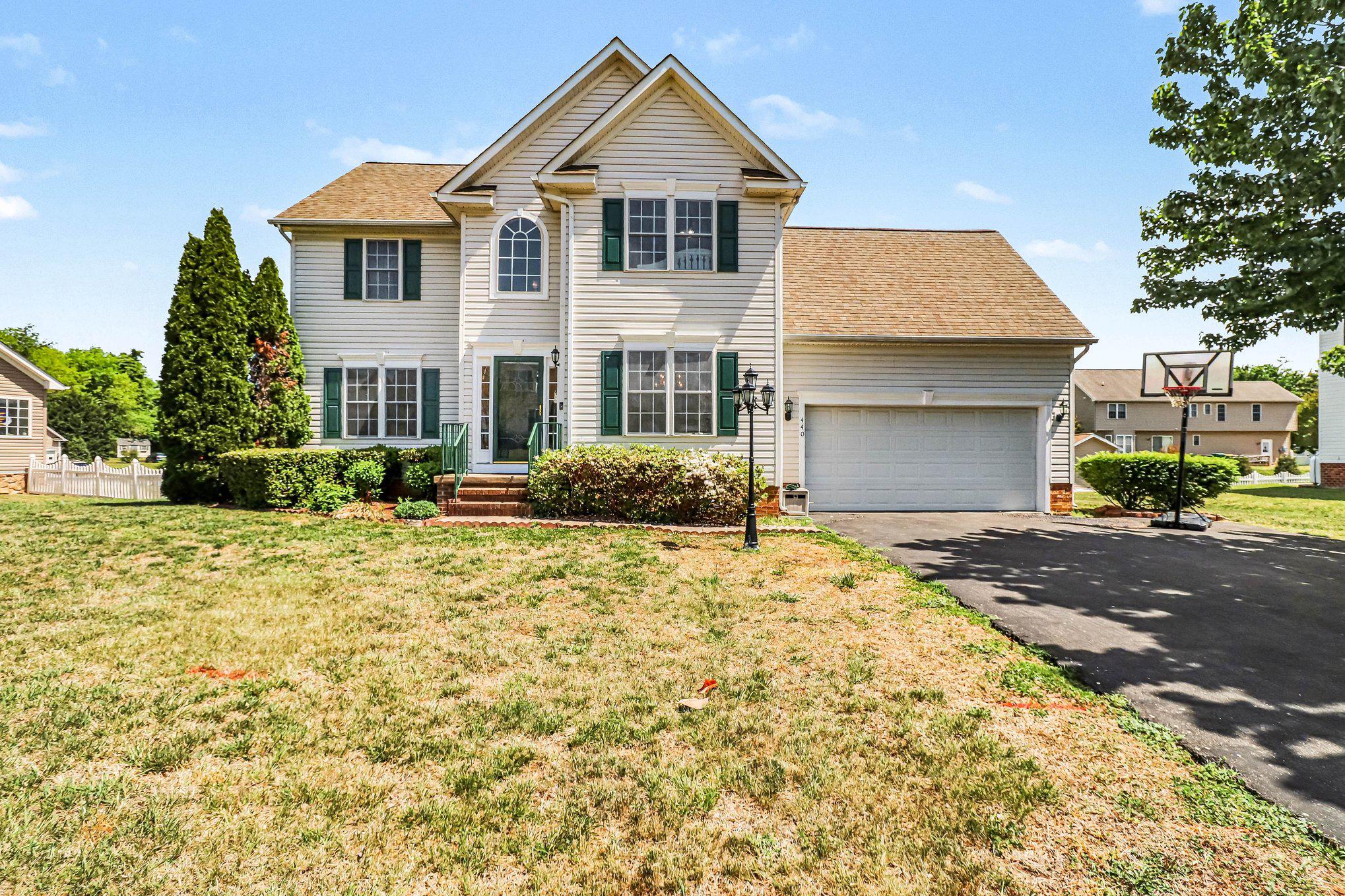 Tucked into the desirable Bowling Green Meadows community, this spacious Colonial delivers over 3,000 square feet—featuring 2,100+ finished living space that has been freshly PAINTED. With four bedrooms, two full and two half baths, and a primary suite complete with a jetted tub, separate shower and dual vanities, this home checks all the boxes for space and comfort.Step inside the double story foyer to discover an inviting open floor plan that seamlessly connects the kitchen, dining area, and family room (Gas Fireplace is As-Is but there is propane left in the OWNED Tank), creating an ideal space for gatherings and everyday living. The open kitchen includes a bar height countertop complemented by a convenient pantry and eat-in area. BRAND NEW French Doors lead to the back deck from the living room.  Beautiful Brazilian hardwood floors flow throughout the main living spaces, while cozy carpet adds warmth to the bedrooms. The home also features an unfinished walkout basement with ample potential for additional living space, offering a blank canvas for your personal touch with an already COMPLETED half bath. Outside, the property is set on a generous 0.28-acre lot, featuring a level yard perfect for outdoor activities and gardening. The well-maintained lawn is equipped with a sprinkler system, ensuring lush greenery year-round. Enjoy evenings on the spacious deck, ideal for entertaining or simply unwinding after a long day. Parking is a breeze with a two-car attached garage that has been freshly PAINTED as well and additional driveway space for four vehicles. DUAL ZONE HVAC installed 2 years ago. Bowling Green Meadows is not just a place to live; it's a vibrant community with access to excellent local amenities. Residents benefit from nearby parks, perfect for leisurely strolls or picnics, and a variety of shopping and dining options just a short walk away.  The Main St area hosts Fourth Fridays from April-September, a Farmer's Market every Saturday, and hosts several community activities such as a Harvest Festival and a Christmas Parade. Enjoy dining and shopping at several mom and pop shops including an Ice Cream shop where people from all around come to visit. This is an amazing Golf Cart community to call home!