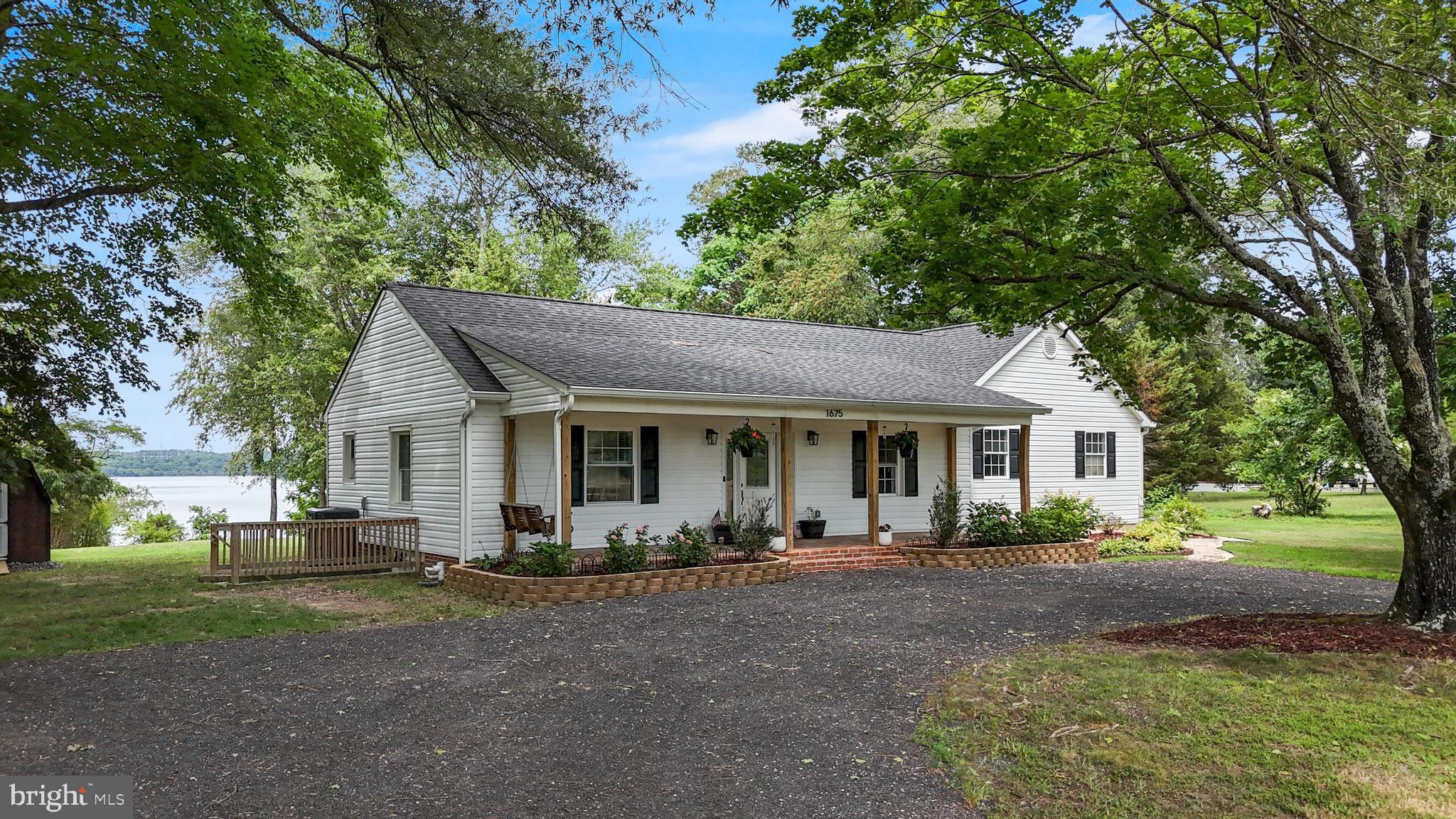 Welcome to your own private slice of Southern Maryland! Perfectly situated on an acre, this beautifully updated rambler offers breathtaking Patuxent River views, peaceful farmland views from the front, and all of the modern updates you would want. Tucked near the end of Mallard Point with only a handful of homes beyond it, this property offers a quiet setting where nature takes center stage. The inviting brick front porch welcomes you inside to an open floor plan with vaulted ceilings and luxury vinyl plank flooring throughout the main level. The updated kitchen is complete with quartz countertops, 42-inch soft-close white cabinetry, and newer appliances. Recent improvements include a new refrigerator (2023), oven (2023), dishwasher (2023), washer (2026) and dryer (2025), whole housand abundant recessed lighting, making this home truly move-in ready. The home features four total bedrooms. One oversized bedroom offers beautiful views of the waterfront backyard, while the remaining bedrooms are all generously sized and share an updated full bathroom. Step outside onto the brand-new deck overlooking the expansive backyard and enjoy panoramic Patuxent River views. Whether you're sipping your morning coffee or unwinding after a long day, you'll appreciate the incredible wildlife that calls this area home. Watch ospreys nesting nearby, spot bald eagles soaring overhead, and regularly see deer, foxes, turtles, groundhogs, and countless species of birds right from your own backyard. Additional updates include a new roof and gutters (2023), new HVAC system (2023), some newer windows, and a new pressure tank (2025), offering years of worry-free ownership. If you've been searching for privacy, peaceful surroundings, spectacular Patuxent River views, and a home that's been extensively updated, this is one you won't want to miss.