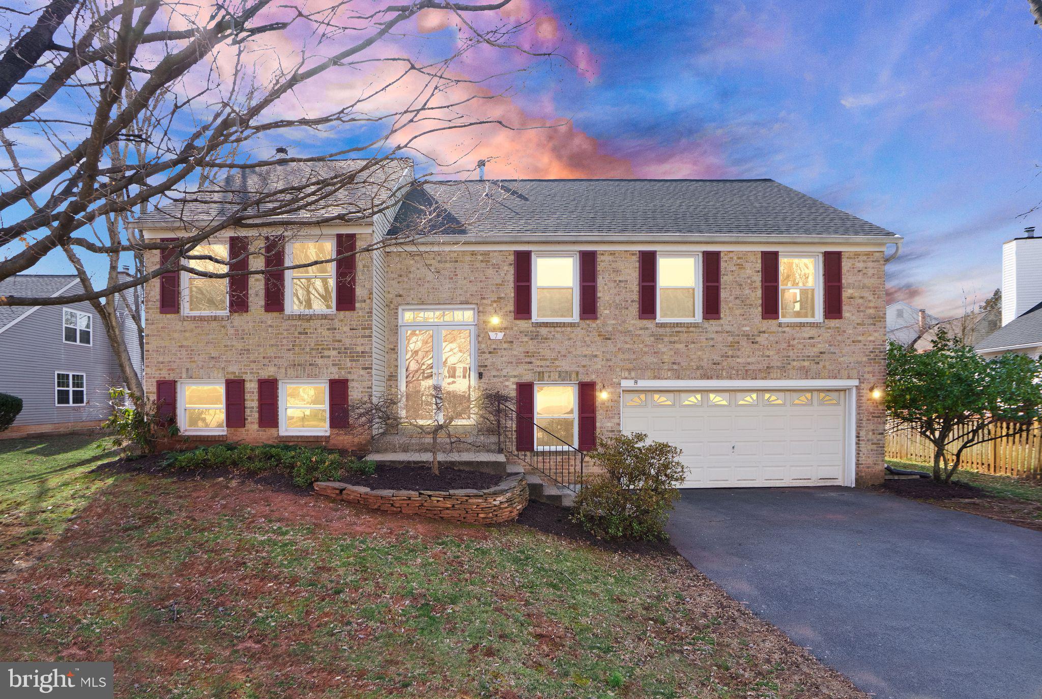 This stunning home blends comfort, style, and functionality with 3 spacious bedrooms, 3 bathrooms, a large fenced yard with deck, and a finished basement with office. Don't miss the chance to see this home, ideally located on a cul-de-sac lot. It comes with a 2-car garage and features hardwood floors throughout the living room, dining room, and kitchen. The kitchen offers granite countertops, stainless steel appliances, and 42-inch cabinetry, making it a great spot for cooking and entertaining. The living room boasts a striking cathedral ceiling, adding an open and airy feel to the space. The primary bedroom includes two closets and a private bath, while two secondary bedrooms share a full bath, providing ample space for everyone. The finished lower level offers additional living space with a cozy rec room featuring a fireplace, an office with a full bath, laundry and plenty of storage. Updates include new range (11/2024), new dishwasher (10/2024), new microwave (10/2024), new fridge (03/2022) new roof (10/2024), HVAC (05/2021) and a new deck (03/2024) that's perfect for outdoor enjoyment. Plus, you’re just minutes from Rt. 7 and Rt. 28, offering easy access to shopping, dining, and commuting routes. This is a home that truly has it all—schedule your tour today!
