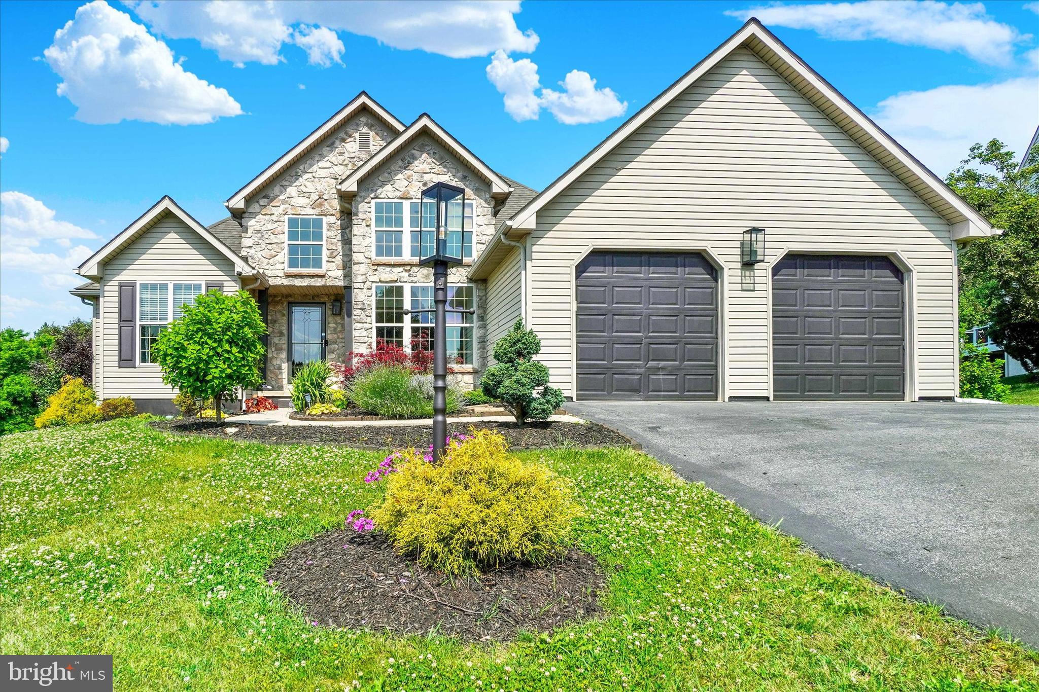 Experience elevated one-level living in this gorgeous 3 bedroom, 3 full bath contemporary ranch style home in sought-after Dallastown Schools!  From the minute you step through the front door, you will love the bright, open feel of this home!  The living room, dining and kitchen areas flow seamlessly together, and are bathed in natural light, making it the heart of the home.  Just off the beautifully appointed kitchen is the sun room, with French doors leading to the rear patios and backyard.  The open floor plan boasts a primary suite with deluxe bath, including a walk-in shower and spa tub,  as well as two additional bedrooms, second full bath and convenient laundry completing the main level.  The partially finished lower level features a large family room, and a third full bath, as well as plenty of unfinished space for storage or adding future living space. The prime lot offers an expansive backyard with amazing views from the two-tiered patio, and a peaceful setting backing to woods and pasture.  The sellers are even including a nearly new hot tub and a one year First American Home Warranty for your peace of mind! Ideally located in a small, thoughtfully planned neighborhood with walking trails, tucked away just minutes from I-83, Exit 10, for easy commute to MD or points north.