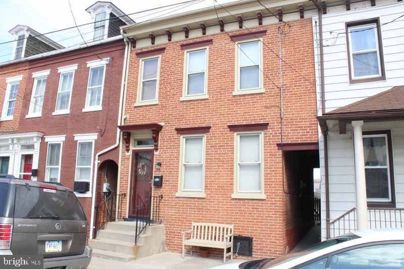 Well maintained 3 bedroom brick row home in Columbia.  New drywall throughout, new kitchen and new bathroom. Hardwood floors in living room and dining area, spacious bedrooms, central air and rear covered patio leads to fenced in backyard.