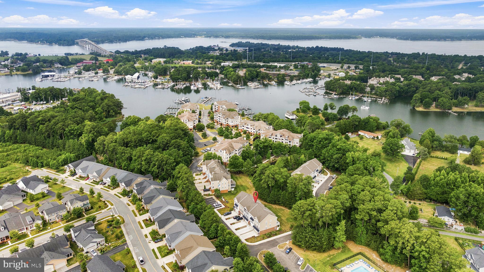 ***Welcome to your own slice of paradise in beautiful Solomons! *** Built in 2024, this stunning home offers the perfect blend of modern luxury and low-maintenance living in one of Southern Maryland’s most desirable waterfront communities. Enjoy resort-style amenities including a community pool, tennis courts, clubhouse, and water access. Spend your days kayaking, fishing, or crabbing just steps from your front door, then relax and take in breathtaking Solomons sunsets. Inside, you’ll find three finished levels featuring 4 bedrooms, 3.5 baths, and an open-concept floor plan with 9-foot ceilings throughout the main living area. The beautifully appointed kitchen boasts granite countertops, abundant cabinetry, and a spacious layout that’s perfect for entertaining. Step outside to the rear deck overlooking peaceful, wooded views- an ideal spot to enjoy your morning coffee or unwind after a day on the water. Whether you’re looking for a full-time residence or a weekend retreat, this nearly new home offers the carefree coastal lifestyle you’ve been dreaming of- all while feeling like you’re on vacation every day.  Boat slips may be available for separate purchase.