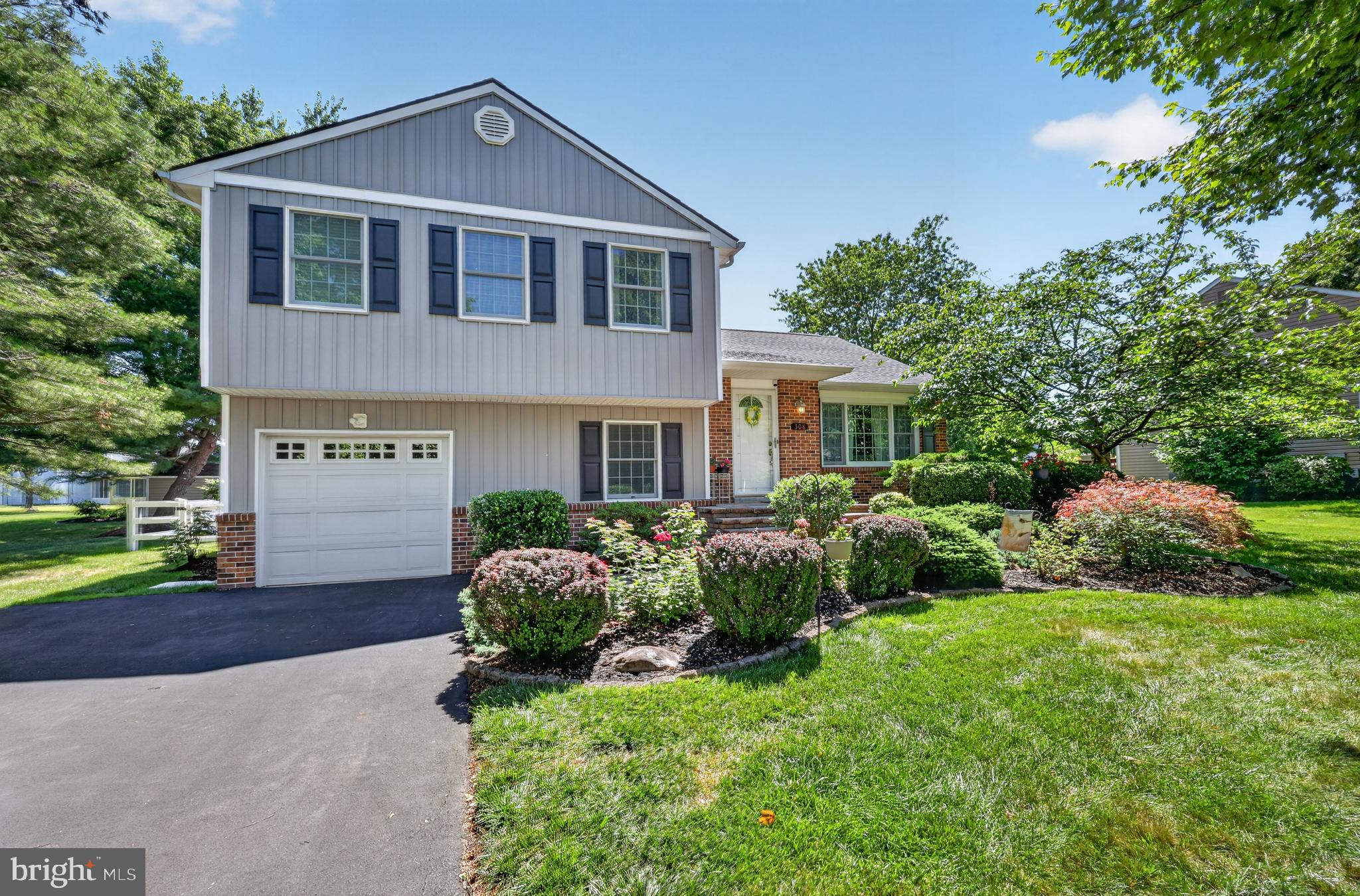 Welcome to this well-maintained split-level home situated on a .30-acre fenced lot in the desirable Oxford Glen neighborhood of Lower Makefield Township. Offering 3 bedrooms, 2.5 baths, a one-car garage, and an unfinished basement, this home features a functional floor plan, spacious living areas, and thoughtful updates throughout. Located within the award-winning Pennsbury School District, this home combines comfort, convenience, and lasting value. Step inside to a welcoming foyer with a convenient coat closet before entering the bright living room featuring hardwood floors and crown molding. The adjoining dining room also offers hardwood flooring and crown molding and opens to the kitchen, creating a comfortable flow for everyday living and entertaining. The kitchen features cherry wood cabinetry, granite countertops, a tile backsplash, recessed lighting, and a breakfast nook. The lower level offers a warm and inviting family room complete with a fireplace, decorative wainscoting, and sliding glass doors leading to the paver patio and fenced backyard, perfect for outdoor entertaining or simply relaxing. A convenient powder room and a spacious laundry/mudroom complete this level. Upstairs, the primary bedroom features an updated private en-suite bath with radiant heated floors, while two additional bedrooms share an updated full hall bathroom. The unfinished basement provides excellent storage space and offers the opportunity to create additional finished living space to suit your needs. Oxford Glen is a well-established neighborhood known for its tree-lined streets, convenient location, and proximity to parks, shopping, dining, and major commuter routes. Located in the highly regarded Pennsbury School District, this home offers a wonderful opportunity to enjoy all that Lower Makefield Township has to offer. Adding to its appeal, the home has benefited from significant improvements, including the roof, HVAC system, and vinyl siding, all replaced between 2018 and 2020, providing added value and peace of mind for the next owner.