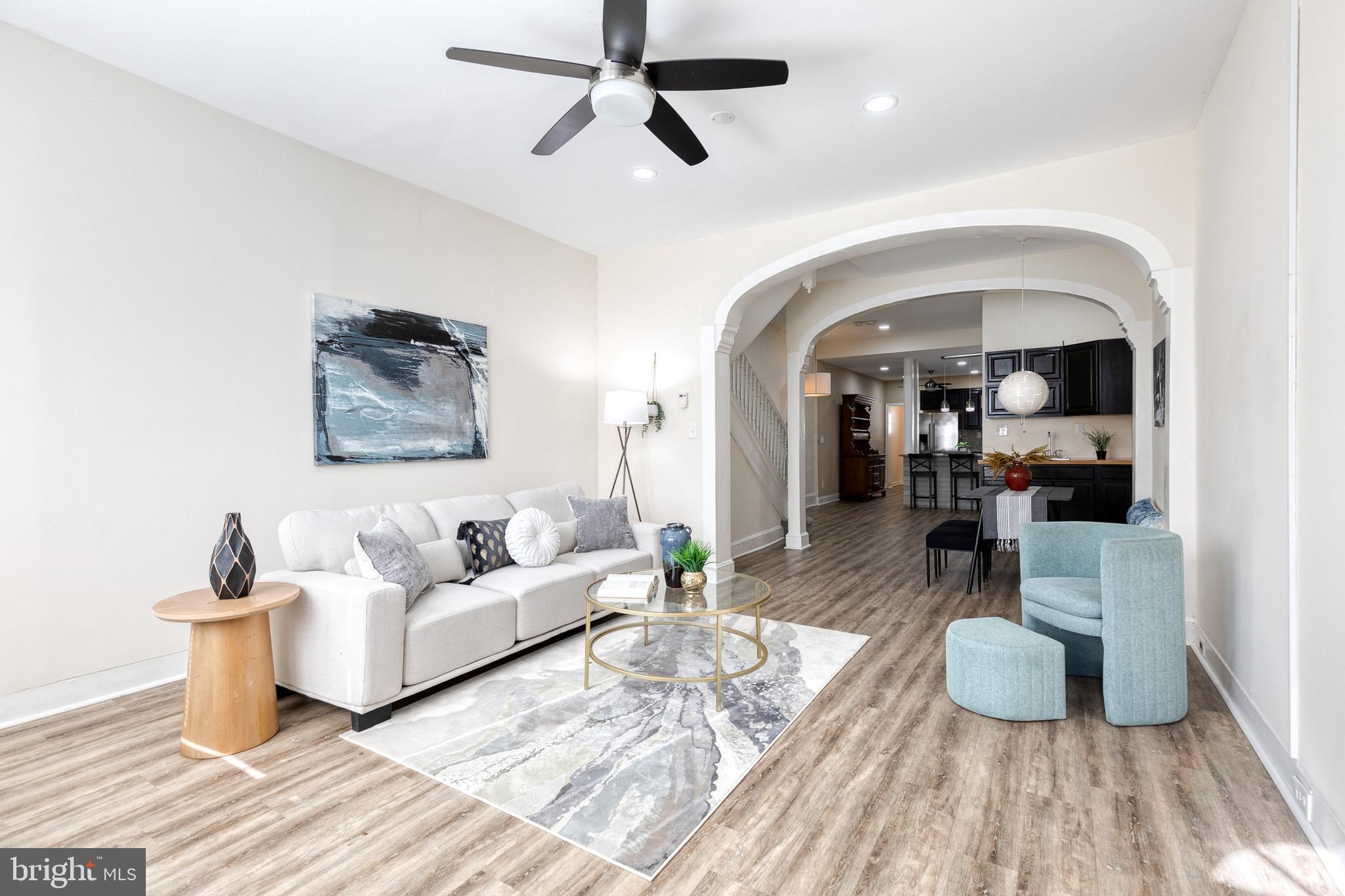 Just blocks from Patterson Park, this charming Highlandtown rowhome offers approximately 1,500 square feet of stylish living space. The open-concept main level features high ceilings, elegant columns, and graceful arches that create a sense of openness and character. A spacious living and dining area includes a convenient wet bar, perfect for entertaining. The beautifully updated kitchen offers ample cabinet space and modern finishes, while a full main-level bathroom adds extra functionality.
Upstairs, discover three generous bedrooms and a second full bathroom, along with plenty of closet and storage space throughout. The lower level provides additional storage and a laundry area. Enjoy city living at its best with easy access to shops, restaurants, and the vibrant energy of Patterson Park just around the corner. Welcome home!