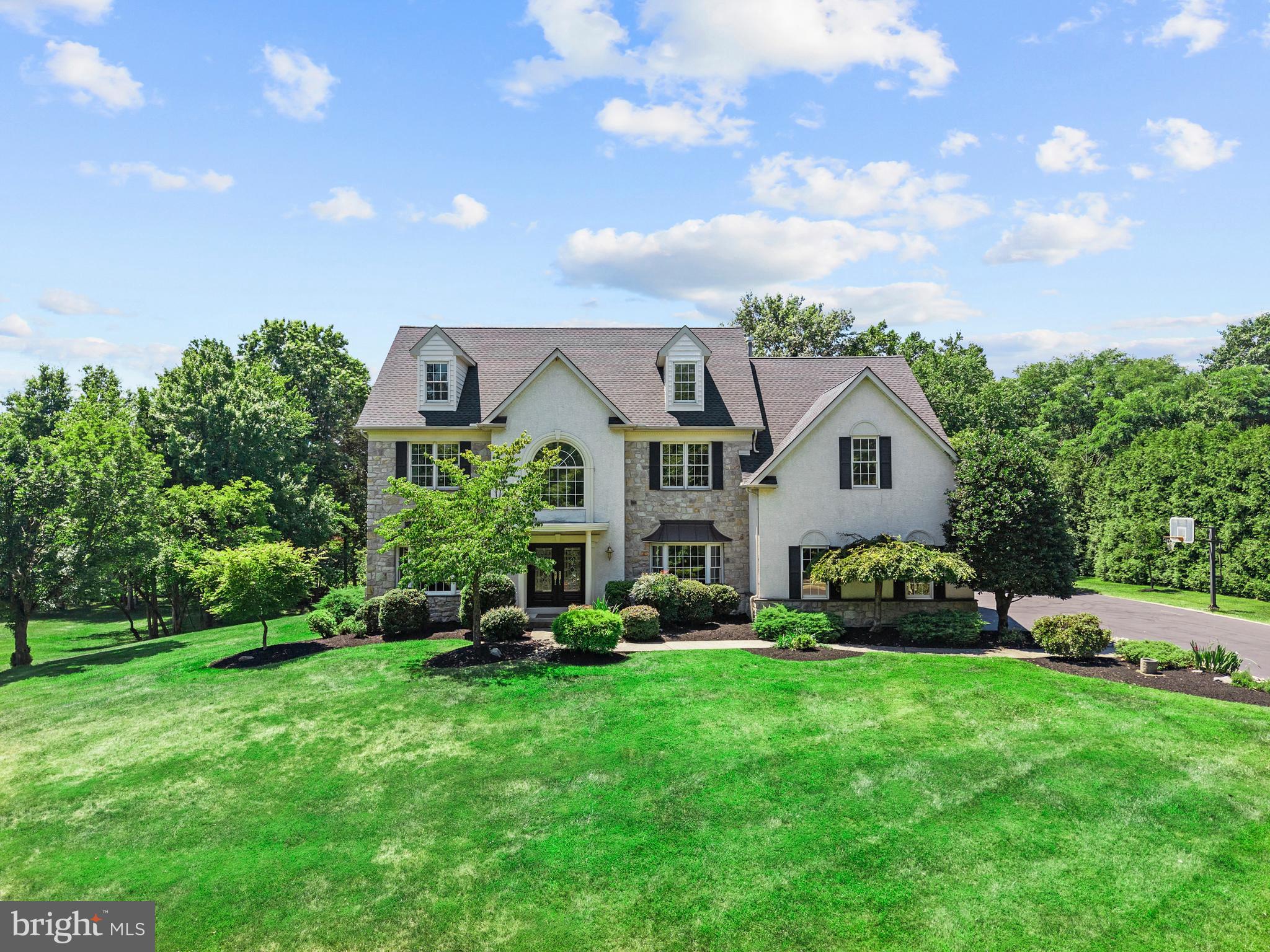Welcome to this exceptional 5,110-square-foot residence (4,010 s.f. 1st and 2nd floor; 1,100 s.f. finished basement, plus approximately 700 s.f. unfinished storage space)  ideally situated on a quiet cul-de-sac in highly sought-after Lower Gwynedd Township. Set on a beautifully landscaped 0.8-acre lot, this meticulously maintained home offers 4 spacious bedrooms, 3 full baths, and 2 half baths, combining timeless elegance, generous living spaces, and extensive recent upgrades.
A dramatic two-story foyer welcomes you inside, where thoughtfully designed living spaces are ideal for both everyday living and effortless entertaining. The first-floor office provides the perfect work-from-home space or private study. At the heart of the home is a spacious kitchen featuring beautiful cherry cabinetry, granite countertops, and abundant workspace, making it ideal for everything from family meals to hosting gatherings. 
The second floor features an expansive primary suite, offering a private retreat with two walk-in closets and a luxurious en-suite bath. Three additional spacious bedrooms provide plenty of room for family and guests. Two bedrooms are connected by a convenient Jack-and-Jill bath, while the fourth bedroom enjoys the privacy of its own en-suite bath. A second-floor laundry room adds everyday convenience.
The professionally finished basement showcases high-end finishes and offers the perfect space for entertaining, movie nights with surround sound, a dedicated exercise area, and abundant storage. Outdoors, enjoy a generous entertaining area with plenty of room for hosting family and friends while taking in the privacy and beauty of the 0.8-acre property.
Recent major improvements provide exceptional value and peace of mind, including a new hot water heater (2022), two new HVAC systems (2023), a 50-year GAF roof (2023), a Generac whole-house standby generator (2024), an epoxy-coated floor in the 3-car garage (2026), and a new Fypon railing is currently being installed over the front portico (2026).
Enjoy the tranquility of cul-de-sac living while remaining just minutes from premier shopping, dining, parks, and major commuter routes. Located within the award-winning Wissahickon School District, this outstanding home offers a rare opportunity to own a meticulously maintained property in one of Montgomery County's most desirable communities.
From its spacious layout and quality craftsmanship to its impressive list of updates, exceptional outdoor living space, and prime location, this truly move-in-ready home offers the perfect setting for creating lasting memories.
Schedule your private showing today!