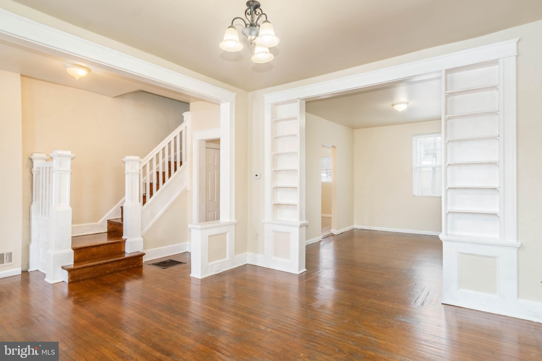 TURN KEY PORCH FRONT ROWHOME WITH OVER 1,300 SQ. FT. OF LIVING SPACE!  Features include gleaming hardwood floors throughout, a main level with a spacious living room with built-in bookcases, separate dining room, and galley kitchen.  The upper level offers 3 bedrooms and 1 full bath and the unfinished basement is perfect for storage.  Perfect opportunity for an investor looking to add to their rental portfolio or even a homebuyer looking for an affordable move-in ready home!
