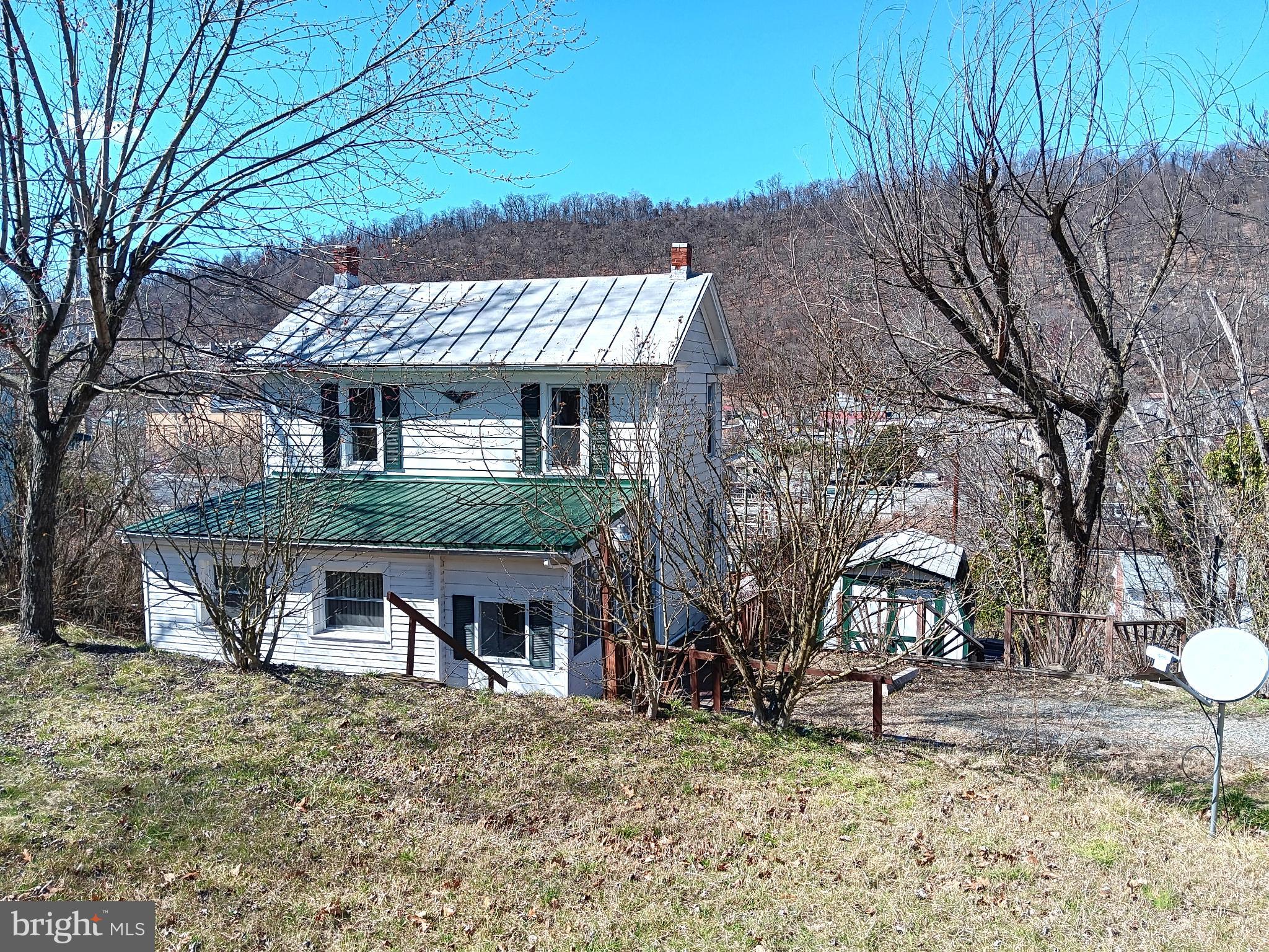 Affordable opportunity in the town limits of Berkeley Springs! Priced at $110,000, this 3 bedroom, 1 bath home offers approximately 1,319 sq. ft. of living space and is a great option for first time buyers, investors, or anyone looking for an affordable home. The layout includes one bedroom and the full bathroom on the main level, with the other two bedrooms being located upstairs. Most windows have been replaced with vinyl windows, offering improved energy efficiency and lower maintenance. Enjoy the view overlooking the town and mountain in the background. The property offers easy access to Route 522 and Interstate 70, and is within walking distance to downtown, providing convenient access to all the amenities Berkeley Springs has to offer. With its affordable price and convenient location this property presents a great opportunity whether you're searching for a place to call home or as an investment. Call today to schedule your showing. 

Note: The water and heat are currently turned off and will not be turned on for any inspections.