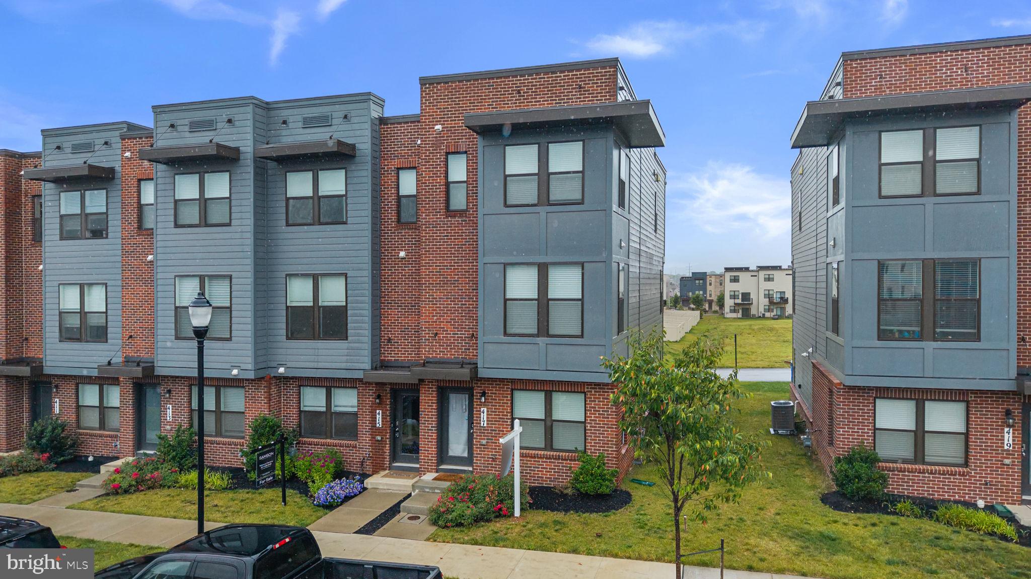 Option to sell FURNISHED! See this exquisite end-of-row townhouse, newly built in 2023 that offers a perfect blend of modern elegance and cozy comfort. With thoughtfully designed living space, this home is ideal for those seeking a sanctuary that feels both spacious and inviting. The kitchen is a chef's dream, featuring a large island, all stainless steel appliances, as well as a gas cooktop with down draft. The abundance of recessed lighting enhances the warm ambiance, making it a delightful space to prepare meals and gather with loved ones. The living area also boasts a dedicated dining area, perfect for hosting dinner parties or casual meals next to a large balcony. Four spacious bedrooms spread out, with one on the main level, one on the upper level and the upper level providing two primary suites. Both a true retreat, complete with a luxurious en-suite bathroom and a spacious walk-in closet, ensuring ample storage for all your essentials. Outside, the property is equally inviting. Enjoy the fresh air on your private deck, perfect for morning coffee or evening relaxation. The community offers a play area and well-maintained sidewalks, ideal for leisurely strolls or outdoor activities. Plus, residents can take advantage of the community pool, providing a refreshing escape during warm summer days. Parking is a breeze with an attached rear-entry garage, ensuring convenience and security. The home is situated on the end of the street with just enough providing outdoor space to enjoy. This property is not just a house; it's a place to create lasting memories. With its modern amenities, thoughtful design, and welcoming community, this townhouse is ready to be called home. Don't miss the opportunity to make it yours!