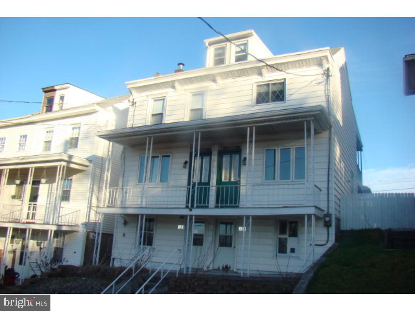 Two attached singles for one price! This duplex property sits high in New Minersville with great city views. The main unit offers a newer kitchen with adjoining laundry room and half bath and a large living room area. Upstairs there are three nicely sized bedrooms and a full bath. The second unit, a great rental opportunity, has large kitchen, living room, two bedrooms and one bathroom, along with a private top floor porch. Each unit has their own front and rear entrances, attic and basement for lots of extra storage. Single car garage and rear lawn complete the package.  Mailing Address Continued: Minersville  Color: White  Amp: 100