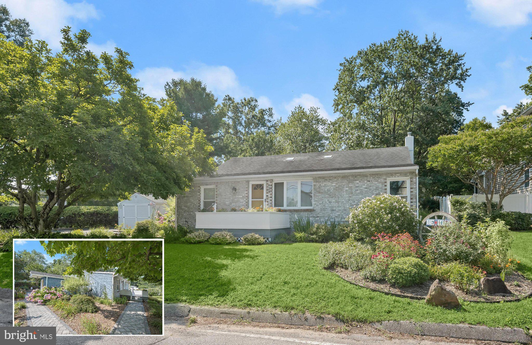 Set in the sought after water oriented community of Arundel Beach, this deceptively spacious brick front rancher offers nearly 4,000 square feet of thoughtfully updated living space designed for everyday comfort and exceptional flexibility. Beautiful landscaping and a refinished driveway create a welcoming first impression, while numerous improvements since 2018, including fresh interior paint, solar tubes that fill the home with natural light, an updated HVAC system, a new water heater, and a beautifully renovated full bath, enhance both style and function.
Inside, a dedicated home office is positioned just off the entry, providing the ideal space for remote work or study. Hardwood flooring, crown molding, and chair railing extend through the open living and dining rooms, where a striking coffered ceiling adds architectural interest to the living area. The kitchen is appointed with granite countertops, stainless steel appliances, ceiling height cabinetry, and a matching built in display cabinet topped with granite that offers additional storage and workspace.
Stretching across the rear of the home, the spacious family room addition is anchored by a charming brick accented wood burning stove and features convenient access to both the backyard and driveway. Four bedrooms and two full baths are located on the main level, including a generously sized primary suite with hardwood flooring and double closets. The renovated hall bath showcases a stylish vanity with an apron front sink, classic black and white tile flooring, and a timeless subway tiled shower with a glass door and coordinating tile niche. One of the additional bedrooms enjoys the privacy of its own en suite bath.
The expansive lower level offers outstanding versatility with a large recreation area, redesigned wet bar, recessed lighting, fifth bedroom, full bath, rough in for a future kitchenette and laundry, and private walk up access to the driveway, making it well suited for an in law suite or extended guest accommodations.
Outdoor living is equally inviting with peaceful back and side yards highlighted by a stone patio, a pond with a waterfall, a French drain system, and two storage sheds with electricity. Adding to the sense of privacy, the adjacent lot is protected by a conservation easement, as shown on the recorded plat, preserving the natural setting and ensuring that no future development can be built there. Located adjacent to Cattail Creek off the Magothy, residents of Arundel Beach enjoy nearby public water access points and membership marinas along the Magothy River, with easy access to boating, kayaking, fishing, waterfront parks, the scenic Baltimore & Annapolis Trail, everyday shopping and dining, and highly regarded Severna Park schools.