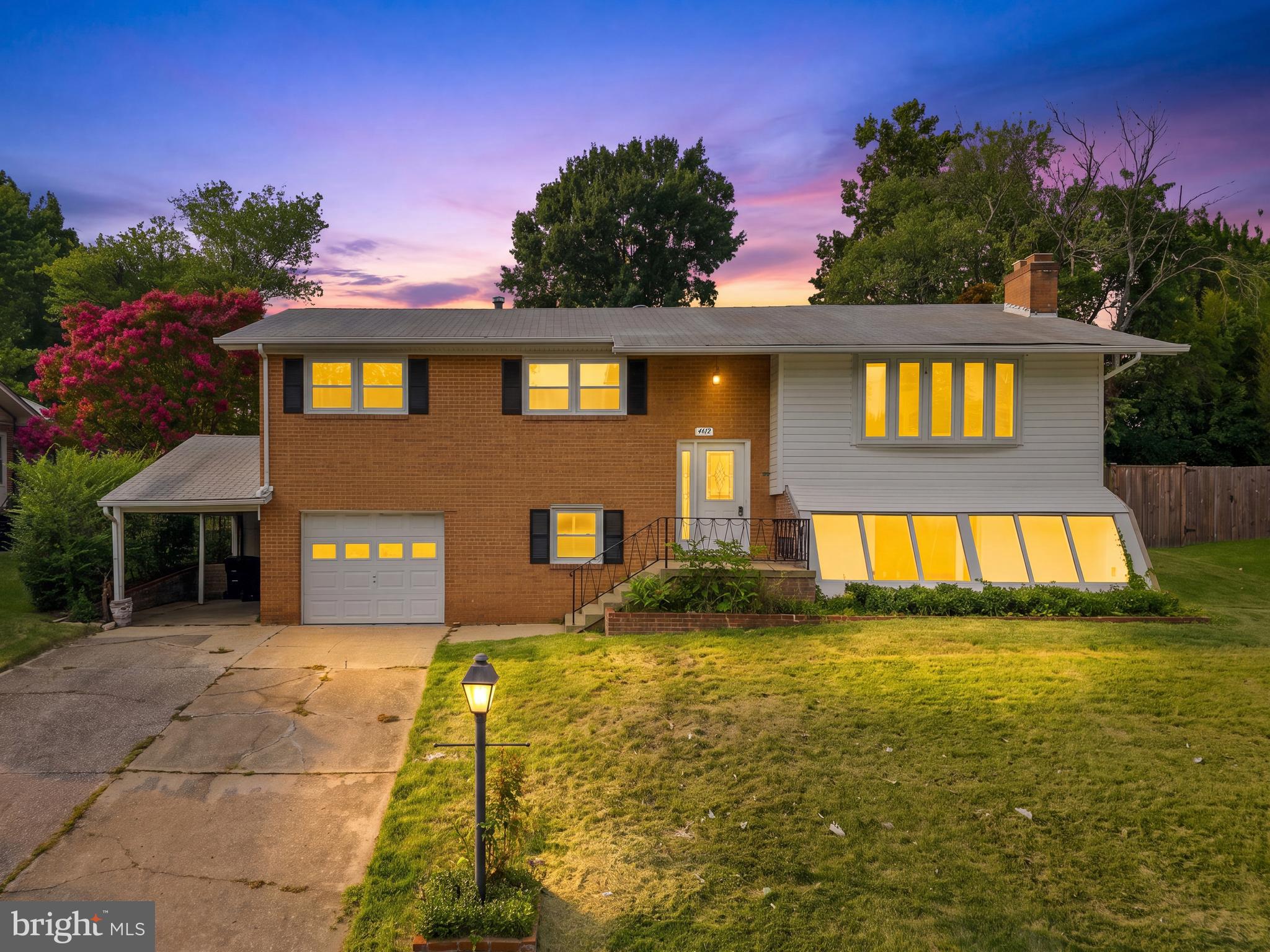 Welcome to this beautifully updated all-brick split foyer offering over 4 bedrooms, 3 full bathrooms, and exceptional flexibility for today's lifestyle. Thoughtfully maintained by its original owner and extensively renovated, this spacious home features an open-concept main level with gleaming hardwood floors, abundant natural light, and a seamless flow for everyday living and entertaining.

The brand-new kitchen is the centerpiece of the home, showcasing quartz countertops, stainless steel appliances, stylish cabinetry, luxury vinyl plank flooring, and a large center island overlooking the living and dining areas. The dining room opens to a rear deck and fully fenced backyard, creating the perfect indoor-outdoor entertaining space.

The main level includes three generously sized bedrooms, including a spacious primary suite with a beautifully updated private bath. The finished lower level offers a large recreation room filled with natural light, a fourth bedroom, a third full bathroom, making this home well suited for multigenerational living.

Outside, enjoy a private, fully fenced backyard, a unique greenhouse addition, a one-car garage, covered carport, and a private driveway with ample parking.

Conveniently located just minutes from shopping, dining, parks, and major commuter routes, this move-in-ready home combines modern updates, generous living space, and timeless construction in a location you'll love.