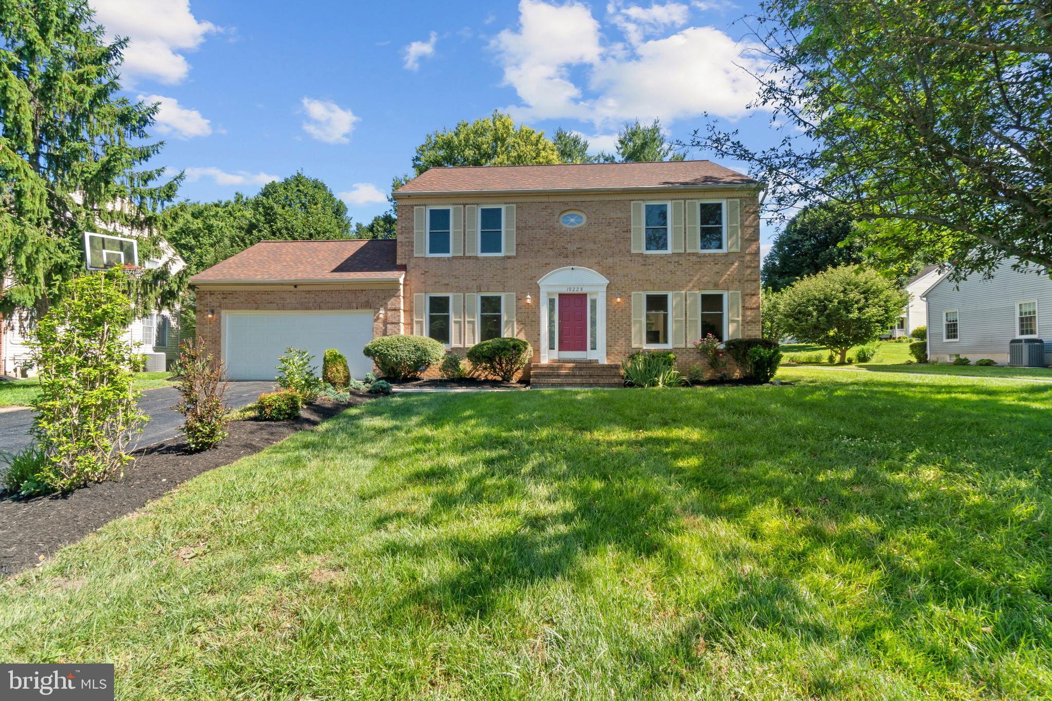 Beautifully updated Colonial residence offering 4 bedrooms, 3 full and 1 half bathrooms, and 3,260 finished square feet on a picturesque homesite in desirable The Fairways. Major recent improvements include fully renovated main and upper-level bathrooms in 2026 and replacement windows in 2023. // A private driveway lined with lush landscaping leads to the attached 2-car garage and welcomes you into the traditional main level. The foyer is accented by ceramic tile flooring that continues into a convenient powder room. French doors open to a formal living room on one side and a formal dining room on the other, both with hardwood flooring. // The heart of the home is the open-concept great room, featuring a spacious eat-in kitchen updated in 2013 with granite countertops, a center island with breakfast bar seating, a custom backsplash, stainless steel appliances, including a refrigerator and stove replaced in 2022, and a bright breakfast area with exterior access. Open to the kitchen, the impressive family room showcases soaring vaulted ceilings with skylights, hardwood flooring, arched windows, and a brick-accented wood-burning fireplace, creating a warm and inviting atmosphere. // Hardwood flooring continues throughout the upper level, which hosts four bedrooms, including the expansive owner's suite with a walk-in closet and a beautifully renovated private bath featuring a Roman soaking tub, dual-sink vanity, and separate shower. A second full bathroom completes the upper level. // The fully finished lower level expands the living space with a recreation room featuring laminate flooring and ample room for a media center, game table, or lounge area. A versatile bonus room offers flexibility for a home office, playroom, or hobby space, while a well-appointed laundry room provides abundant storage and convenient walk-up exterior access. // A spacious two-tiered deck overlooks the expansive backyard framed by mature trees, creating a private and picturesque setting for outdoor relaxation and entertaining. // Ideally situated in Ellicott City, The Fairways offers convenient access to shopping, dining, healthcare, and everyday necessities, including CVS, Walgreens, FirstCall Medical Center, and Enchanted Forest Shopping Center, featuring Safeway, SECU, restaurants, and an array of retail destinations.
