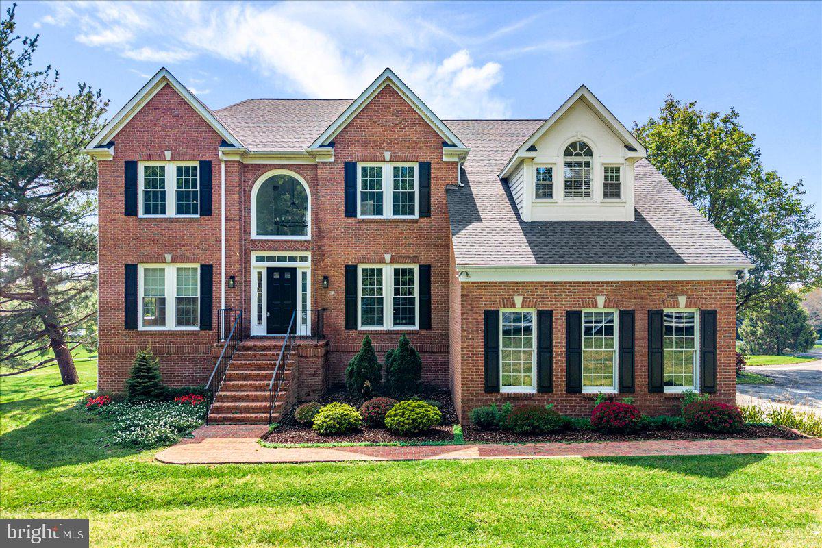 ****NEW PRICE**** Experience the pinnacle of refined living in this extraordinary Colonial estate, gracefully set on 2.52 acres in the prestigious Paddocks community, directly across from the scenic Challedon Golf Course. Located in the heart of Mt. Airy, this exceptional home offers both the charm of a vibrant Main Street and the convenience of easy commuting to Washington, DC, Frederick, and Baltimore.

Completely reimagined with a comprehensive 2026 renovation, this 5,100+ square-foot residence seamlessly blends timeless architecture with sophisticated modern design. From the moment you step into the impressive, light-filled foyer—accentuated by elegant lighting and newly updated flooring—you are welcomed into a home defined by quality craftsmanship and thoughtful detail.

At the heart of the home, the gourmet kitchen is designed to impress, featuring a large center island, upgraded countertops, and ENERGY STAR stainless steel appliances. It flows effortlessly into the inviting family room, anchored by a cozy wood-burning fireplace—perfect for both entertaining and quiet evenings at home. Just beyond, the sunroom with vaulted skylights offers a tranquil setting to relax and take in the expansive views.

The expansive bedrooms provide comfort and retreat, each offering generous proportions, abundant natural light, and serene, far-reaching views of the surrounding landscape. Throughout the home, modern plumbing fixtures and refined finishes elevate everyday living, while stylish lighting elements add warmth and sophistication to every space.

The luxurious primary suite serves as a private sanctuary, complete with a spa-inspired bath featuring a soaking tub, separate enclosed shower, and dual vanities. A fully finished walk-out basement adds versatile living space, while energy-efficient windows, meticulous crown molding, and numerous system upgrades ensure comfort and peace of mind for years to come.

Additional improvements include new upper-level windows, HVAC system, and water heater (2022), as well as a new fireplace flue and radiant heatilator, fresh paint throughout, upgraded carpeting, new kitchen and foyer flooring, and a beautifully crafted cedar deck—all completed in 2026. Pre-inspected for added confidence, this remarkable property offers the perfect blend of luxury, function, and modern elegance.

Don’t miss the opportunity to own this exceptional home—Welcome Home!