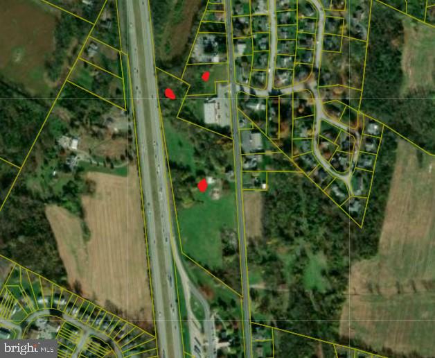 Approx 13 acres of land for commercial use on Molly Pitcher Highway, backs Interstate 81, joins PA Welcome Center.  Property is zoned Community Commercial.
In Franklin County, situated along Interstate 81 in south central Pennsylvania, approx 50 miles south of Harrisburg, and 90 miles west of Baltimore-Washington Beltways.
Property includes 2 parcels.
There is an old house and garage on the property that has not been used in years.  Seller does use garage, any contents do not convey.