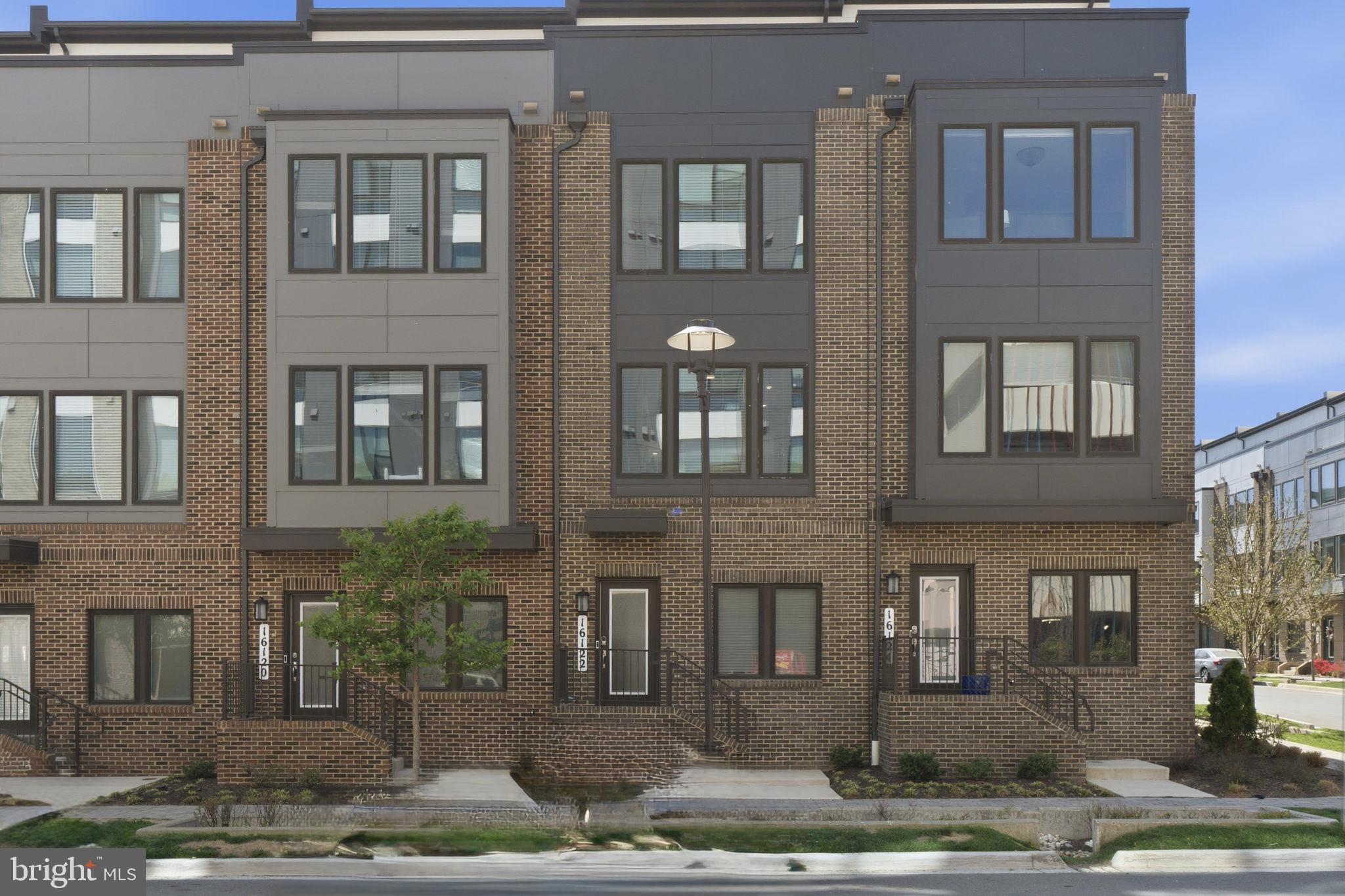 Welcome home to this stunning, nearly-new 2021-built rowhome that perfectly blends modern style with everyday convenience—all just a short 10-minute stroll to Shady Grove Metro. Spanning four thoughtfully designed levels, this 3-bedroom, 3.5-bath home offers the space, layout, and finishes. The heart of the home is an open-concept main level filled with natural light, featuring a sleek kitchen with gray cabinetry, granite countertops, and stainless steel appliances. Step right out from the dining area onto your private deck—perfect for morning coffee or unwinding after a long day. Upstairs, each bedroom serves as its own private retreat with en-suite bathrooms, offering comfort and flexibility for roommates, guests, or working from home. The top level truly sets this home apart, with a second living space that opens to a rooftop terrace—ideal for entertaining, relaxing, or enjoying the views. Complete with a 2-car garage and located in a vibrant, newer community, this home checks every box for style, space, and location.