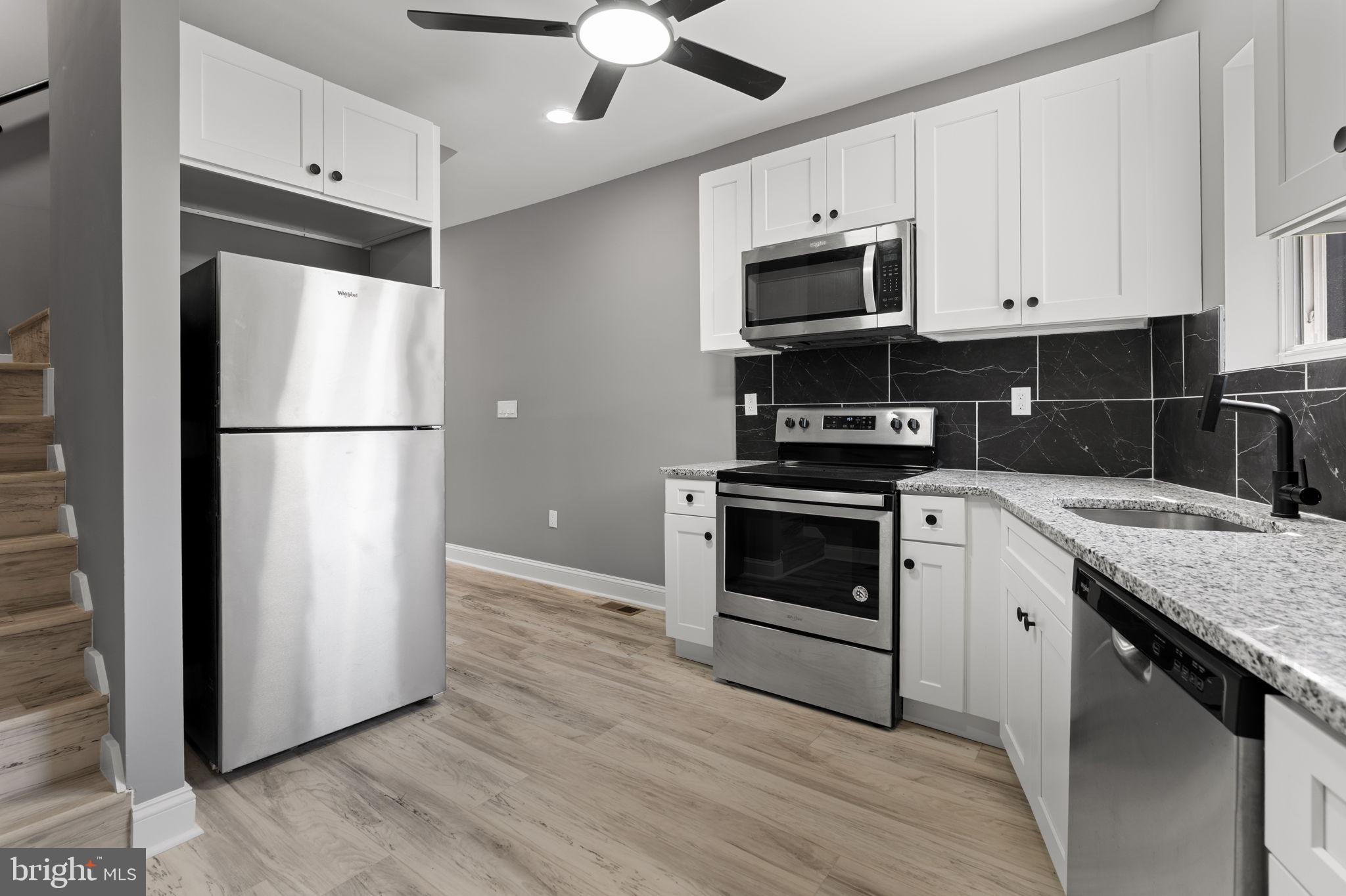 1807 Hollins Street is a beautifully renovated brick townhome located in the historic Hollins Market/Union Square area of Baltimore. This spacious home offers 3 bedrooms, 3 full bathrooms, and approximately 1,368 square feet of updated living space, blending modern finishes with classic Baltimore rowhome charm. The property features a thoughtfully designed layout with generous living areas, updated flooring, contemporary bathrooms, and a renovated kitchen perfect for everyday living and entertaining.

Originally built in 1920, this home has been revitalized while still maintaining the character and architectural style that make Baltimore rowhomes so desirable. Located in the growing Hollins Market neighborhood, the property is just minutes from Downtown Baltimore, the Inner Harbor, Camden Yards, M&T Bank Stadium, the University of Maryland Medical Center, and major commuter routes including I-95