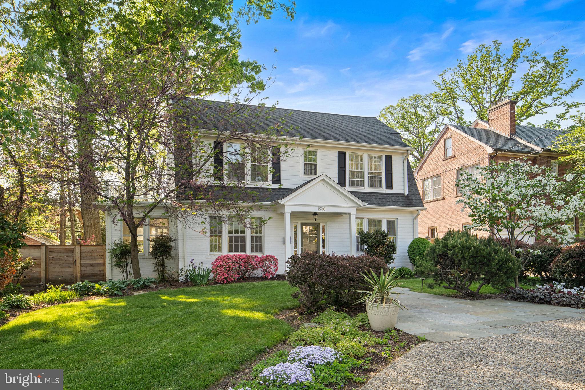 *Assumable VA loan for veterans with entitlement.* Set along sought-after Arlington Ridge Road, this expanded Dutch Colonial blends classic elegance with a layout that truly lives well. From the moment you arrive, the home has a presence that feels both timeless and welcoming.

Inside, hardwood floors run throughout the main and upper levels, complemented by detailed picture molding that adds character in all the right places. The formal dining room is a standout, anchored by a beautiful crystal chandelier that sets the tone for gatherings both large and small. The living room offers a refined yet comfortable space centered around a fireplace with a classic mantel, and just off this room, a light-filled sunroom provides the perfect place to relax, work, or unwind.

A thoughtful rear bump-out addition enhances the flow of the home, creating a more open and connected living experience. The family room feels both grand and inviting, featuring a second fireplace and custom built-ins that anchor the space. It flows seamlessly into the kitchen and out to the backyard, making everyday living and entertaining feel effortless. The kitchen is well-appointed with granite countertops, a built-in desk area, wine storage, and generous cabinet and prep space.

Upstairs, you’ll find four bedrooms and three full baths, including a spacious owner’s suite with dual vanities and an en suite bath. One secondary bedroom also features its own private bath, while the remaining two share a well-appointed hall bath.

The lower level adds even more flexibility, offering a large recreation space with a third fireplace, a fifth bedroom, and a full bath, ideal for guests, extended stays, or additional living space.

Outside, the backyard offers a private and peaceful setting, complete with a flagstone patio and a tranquil pond that creates a quiet retreat. A detached two-car garage sits at the rear of the property, complemented by a long driveway that provides ample additional parking, along with a circular driveway in the front for added convenience and ease.

Arlington Ridge is one of Arlington’s most established and desirable neighborhoods, known for its tree-lined streets, classic homes, and close-knit feel. From here, you’re just minutes to Pentagon City, Amazon HQ2, National Landing, and the shops and restaurants along 23rd Street. Multiple Metro stations, Reagan National Airport, and quick access into DC make commuting simple, while nearby parks, trails, and everyday conveniences round out a lifestyle that’s both connected and easy.

A home that brings together classic charm, thoughtful space, and an unbeatable location.