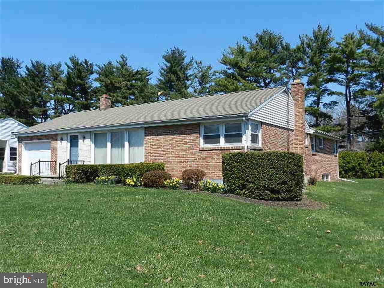Three Bed Rm Brick Rancher w/ Master Bath, & Cedar Closet in Haines Acres. Eat-in kit w/breakfast bar, Dining area & sliding door to Covered Patio. Living Rm w/triple window.  Rec room w/brick fireplace and dry bar. 2 furnaces. 1 car garage with workshop. Replacement windows,  Located on a level yard in a convenient location.  Close to I83 & Rt30.  Must See!!!