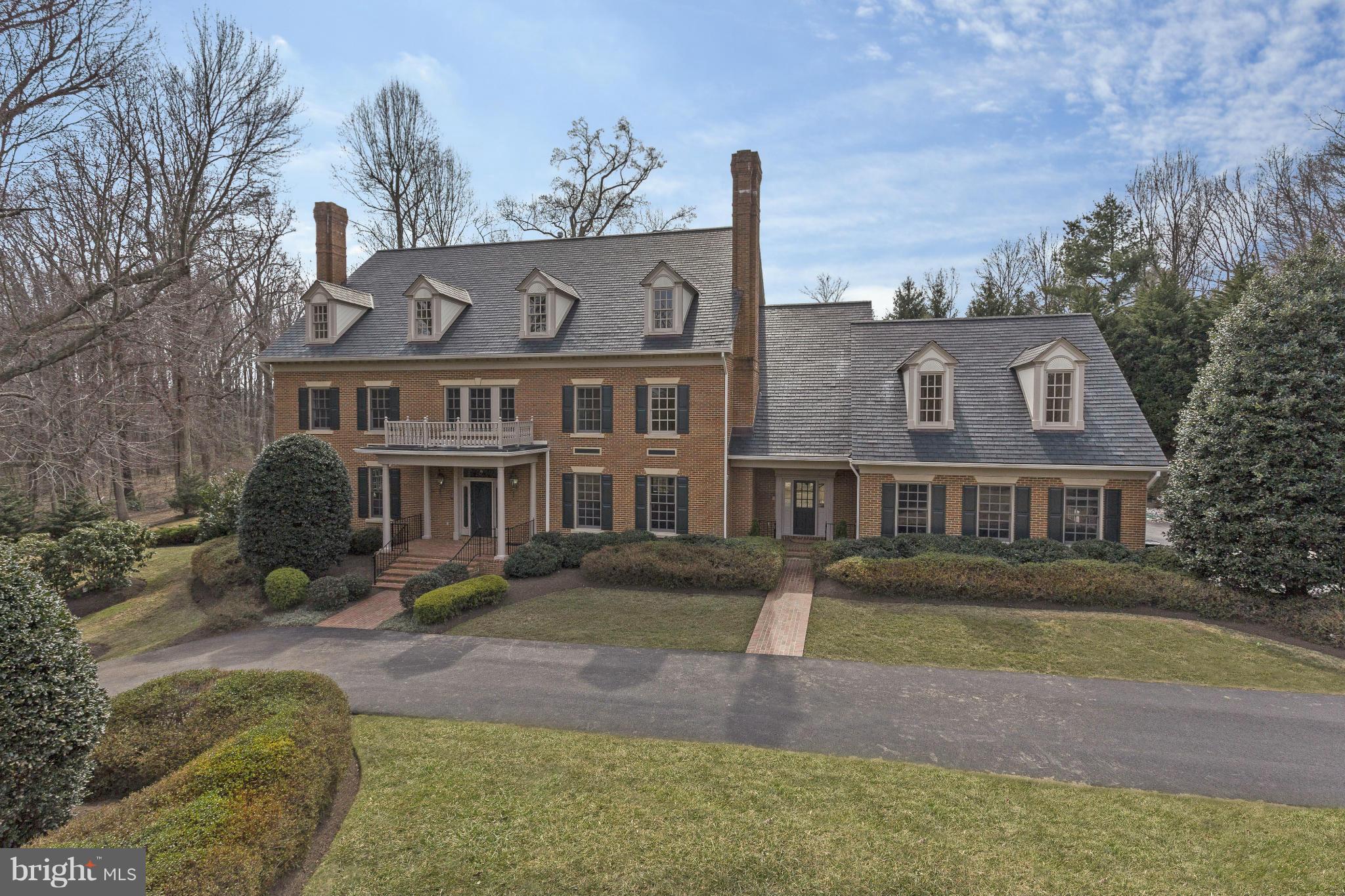Sited on nearly 2.5 acres of expansive, flat grounds, approx 10,000 SF of grand proportion throughout 4 lux levels. Main lvl w/ LR, DR, library, Chef kitch w/ break room &  Fam Rm. Side entry w/ addtl living space. Master w/ marble BA & sitting room. Fully finished LL w/ au-pair ste & recreation room. 7 BRs, 6 Full, 2 Half BAs. 3-car garage, plus circular drive.