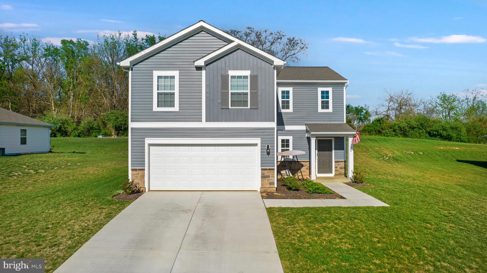 Beautiful like new 4 Bedroom 2.5 bath home in desirable Tollhouse woods, Shepherdstown WV. Close to Shepherd University and a plentitude of shopping and dining options in quaint downtown! The main level features a light filled open floorplan with Gourmet Kitchen, Whirlpool appliances and a center island connecting adjoining dining area, spacious Living Room, and half bath. Upper level has 4 bedrooms and 2 baths including the Primary Owner's Suite with attached bathroom and large walk-in closet.