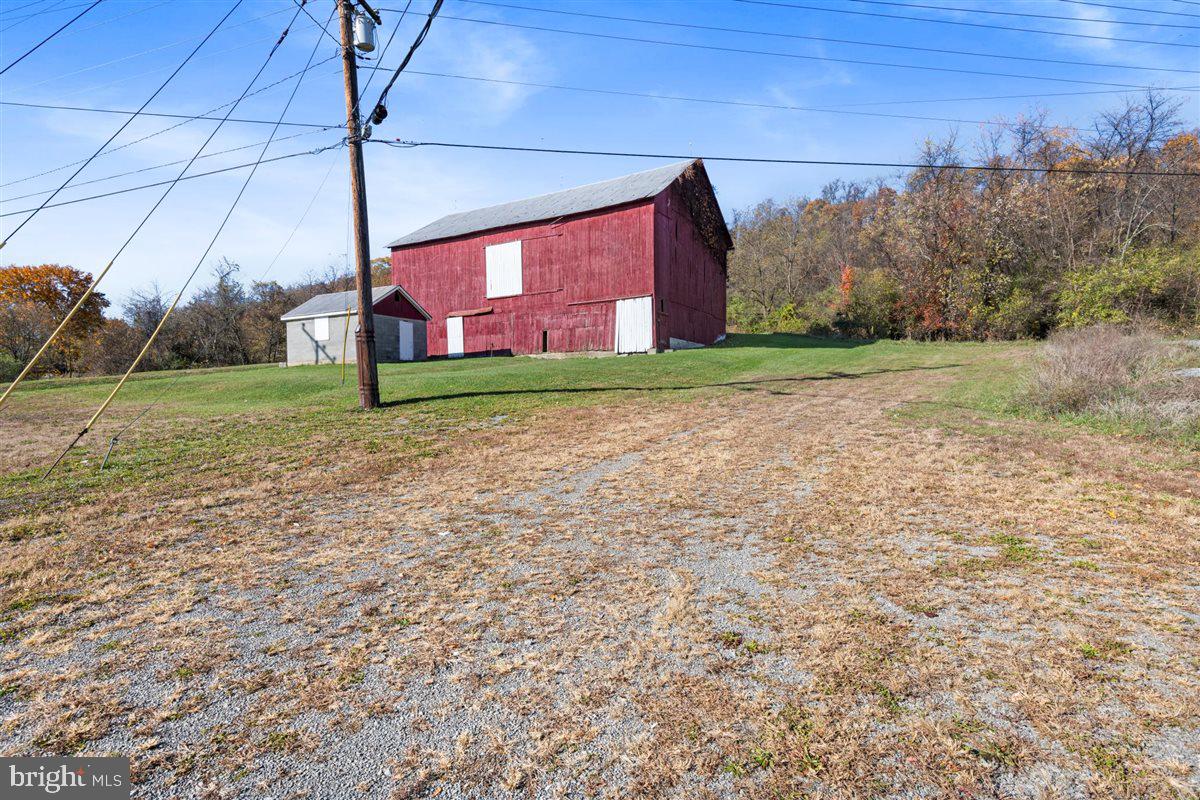 Prime 14+ Acre Development Opportunity in Hancock, Zoned Town Center!

Unlock the full potential of this exceptional 14+ acre property located along bustling Pennsylvania Avenue in Hancock, Maryland. With its high visibility and constant traffic flow, this property offers a rare and valuable opportunity for developers, investors, and visionaries alike. Zoned Town Center, the land provides incredible flexibility for a wide range of uses including residential, commercial, mixed-use, offices, retail, restaurants, clubs, and much more as outlined in the town’s zoning ordinance. Whether you envision a thriving commercial plaza, a modern residential community, or a dynamic mixed-use destination, this land provides the foundation for your vision to become reality.

A large existing barn remains on the property, offering the potential to be creatively repurposed as part of a development plan or removed to create a completely clean slate for new construction. With over 14 acres of versatile land and an unbeatable location in the heart of town, the possibilities are truly endless. The property’s prime location along Pennsylvania Avenue ensures excellent visibility, easy accessibility, and a high daily traffic count, making it ideal for nearly any project.

This is more than just land — it’s an opportunity to shape the future of Hancock’s Town Center. Don’t miss your chance to secure one of the most versatile and strategically located properties in the area.
