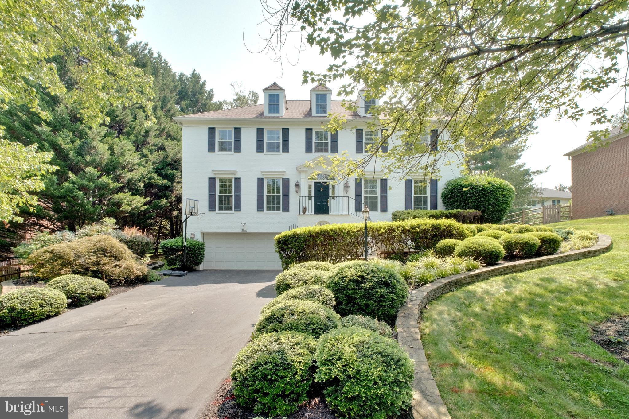 Welcome to Luxury Living in the Heart of Normandy Hills!

Step into this stunning 5-bedroom, 4.5-bath colonial nestled in the prestigious Normandy Hills community. From the moment you enter the sun-drenched foyer, you’re greeted by an elegant curved wooden staircase that sets the tone for the sophisticated design found throughout the home.

Off the grand entryway, you'll find a formal living room and an expansive formal dining room—ideal for entertaining guests or hosting special occasions. Continue through the main level to the heart of the home: a gourmet kitchen outfitted with premium stainless steel appliances, including a double oven and a sleek Bespoke refrigerator. The kitchen also features granite countertops, abundant cabinetry, and a cozy breakfast nook that opens directly to the spacious backyard deck.

Just beyond the kitchen, a second living room with soaring vaulted ceilings invites relaxation and gatherings, seamlessly blending indoor and outdoor living. A stylish powder room on the main level adds convenience for both residents and guests.

Upstairs, retreat to the luxurious primary suite, which includes a private sitting area or home office, multiple walk-in closets, a dressing area, and a spa-inspired en-suite bath. Three additional bedrooms, each with their own full bathrooms and walk-in closets, offer comfort and privacy for family or guests. An upstairs laundry room adds a layer of everyday ease.

The fully finished lower level is designed for versatility, perfect as a home theater, fitness center, or game room. It includes a spacious fifth bedroom, a full bath, and a private walk-out entrance to the front of the home, ideal for guests or an in-law suite.

Additional highlights include beautiful hardwood flooring throughout, recessed lighting, designer light fixtures, an oversized two-car garage with extra storage space, and an extended driveway that accommodates up to four additional vehicles.

This home offers the perfect blend of space, style, and sophistication—all in an exceptional location. Don't miss the opportunity to make this extraordinary property your own. Schedule your private tour today!