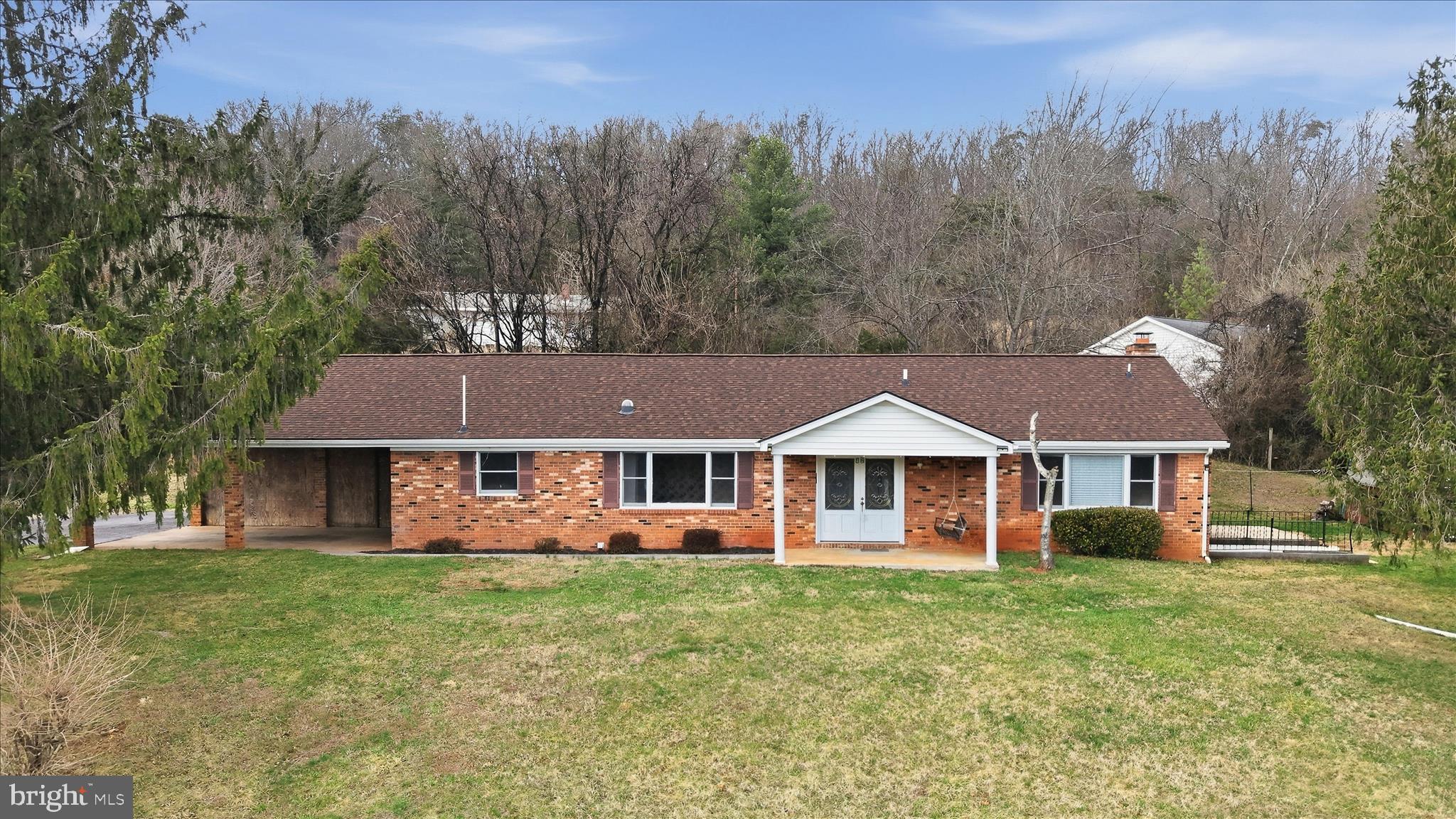 Spacious 4 bed 4 bath home.  With a little TLC you can personalize this blank canvas to your liking.  Perfect multi-generational or large family home. Main level you will find 2 kitchens, (on opposite ends of home)  living  room with gas fireplace, dining, 3/4 beds, and 3 full baths.  Basement offers large family room with wood burning fireplace, kitchenette, full bath,  versatile rec room(s), exercise space or offices.  Nestled on a serene 1 acre lot, this property provides ample space both in and out.  1 car attached garage and 1 car carport.  Enjoy the mountain views from the large front porch.  New roof 2025,  newer well pump and sump pump with drainage system installed in the basement.  2 separate washer/dryer hook-ups one on main level and one located in the basement.  NEW ROOF!! Do not miss the chance to bring your vision to life. Seller will consider all offer!! Located minutes to river access and outdoor activities.