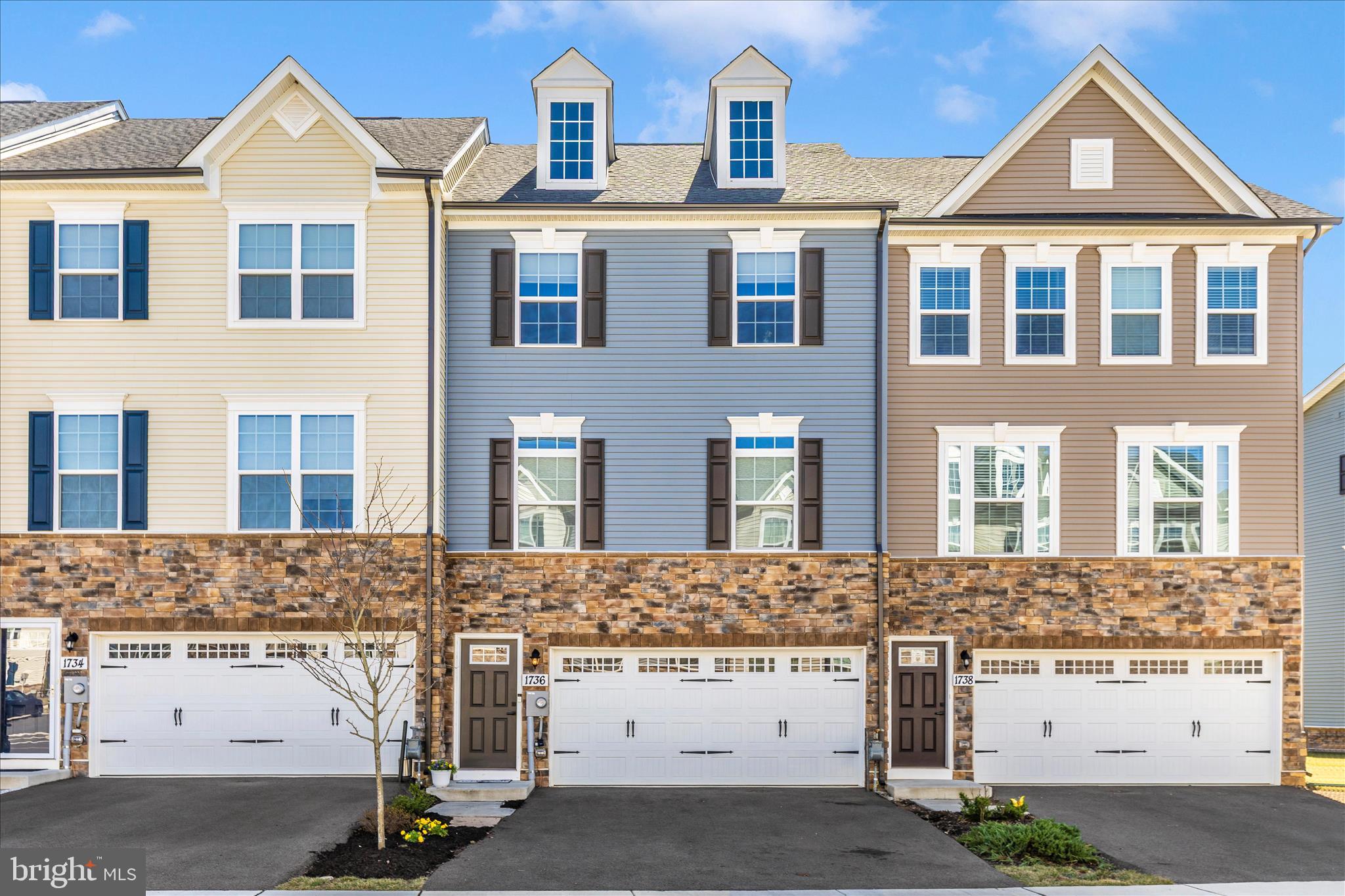 Rare opportunity to own one of the largest models in the sought-after Composer II series. This spacious townhome offers the comfort and design of single-family living with the convenience of a low-maintenance lifestyle.
The light-filled main level features an open-concept layout ideal for everyday living and entertaining. The chef’s kitchen includes an impressive 12-foot center island, perfect for gatherings and casual dining, and flows seamlessly into the expansive great room. A formal dining area provides additional space for hosting. Also on this level is a half bath for guests and convenience. 
The upper level offers three generously sized bedrooms, two full bathrooms, and a convenient second-floor laundry room with shelving and a utility sink. Each bedroom provides ample closet space for storage.
The primary suite features a large walk-in closet and an ensuite bath with dual vanities, a soaking tub, and a separate seated shower.
The lower level includes a spacious flex room that can serve as a home office, TV room, den, or additional bedroom.  A full bathroom and closet on this level adds extra convenience and flexibility for guests or extended living needs.
Enjoy added privacy with no homes directly behind the property, providing peaceful views and a relaxing outdoor setting. A new children’s playground is located just a short distance away, offering a great nearby space for recreation and enjoyment.
A rare chance to own a spacious Composer II model combining comfort, functionality, and low-maintenance townhome living.