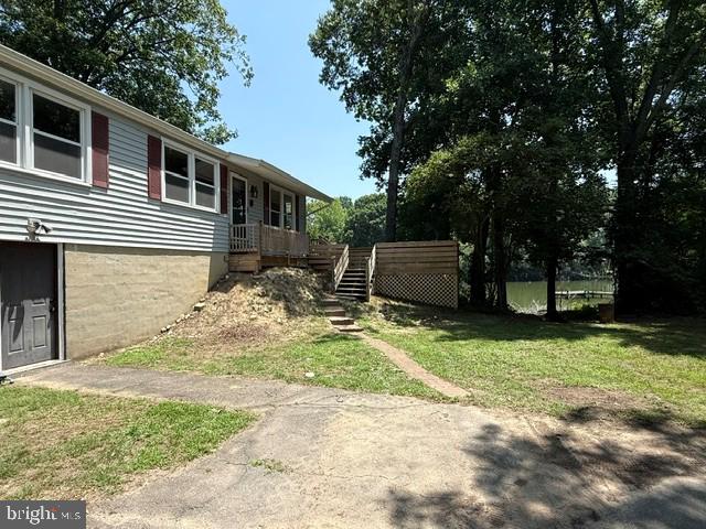Just in time for summer fun, this waterfront home, with private pier, will have you fishing and crabbing from morning until night. Hardwood flooring greets you upon entering and flows throughout most of the main level.  New paint and ceiling fans throughout add a fresh new look. All the electric upstairs has been replaced. Roof is 2 years old. Septic is newer to include drain-fields and distribution box. Washer and dryer and well pump are 2-3 years old.  The basement is unfinished and a blank canvas to make your own. Additionally, this home is not in the flood plain. Owner is still working on the outside of the home.  Professional pictures to follow soon!
