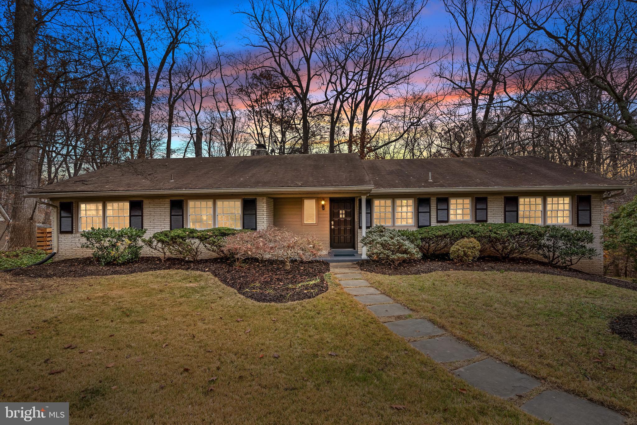 Welcome home! Through the beautiful original front door, you’re welcomed into a spacious main level with hardwood floors, high ceilings, and an open layout that flows seamlessly from room to room. Straight ahead, the expansive living room offers a cozy fireplace and a large picture window overlooking the lush, green backyard. From there, the home opens into an inviting family/TV room, dining area, and an updated kitchen appointed with granite countertops, soft-close maple cabinetry, a gas range, a large pantry with pull-out drawers, and a spacious island with built-in sink and dishwasher - offering both functional utility and visual appeal. Down the main hallway, you’ll find a full bathroom and three bedrooms, including a primary suite with its own en suite bath. Throughout the home, newly installed windows with top-down, bottom-up blinds provide privacy and energy efficiency and many rooms feature Cat-5e ports for fast wired internet. Head downstairs via hardwood stairs with a carpet runner and new banister to reach the finished lower level. This level adds two more bedrooms, a third full bathroom, and a generous recreation room with a second fireplace and walk-out to the back patio - perfect for movie nights or casual gatherings. From there, enter into the 2 car garage with a high voltage EV outlet or a separate utility room that houses major systems including a 2022 gas furnace, a 2018 Navien tankless water heater, and a 2015 LG front-load washer and dryer. Step outside to the serene backyard and patio, nestled within a private lot connected to Pimmit Run - offering a wooded backdrop, meandering stream, and scenic walking trail. Located on the desirable northeastern side of McLean, the home sits within the sought after school pyramid of Chesterbrook Elementary, Longfellow Middle, and McLean High School, and provides quick access to the GW Parkway, Route 123, Tysons, Arlington, and Washington, D.C. With nearly 2,000 finished square feet, 5 bedrooms, 3 updated bathrooms, situated on a street leading to a cul-de-sac with no HOA, this home offers comfort, thoughtful upgrades, and a location that’s hard to beat. Don't miss out!