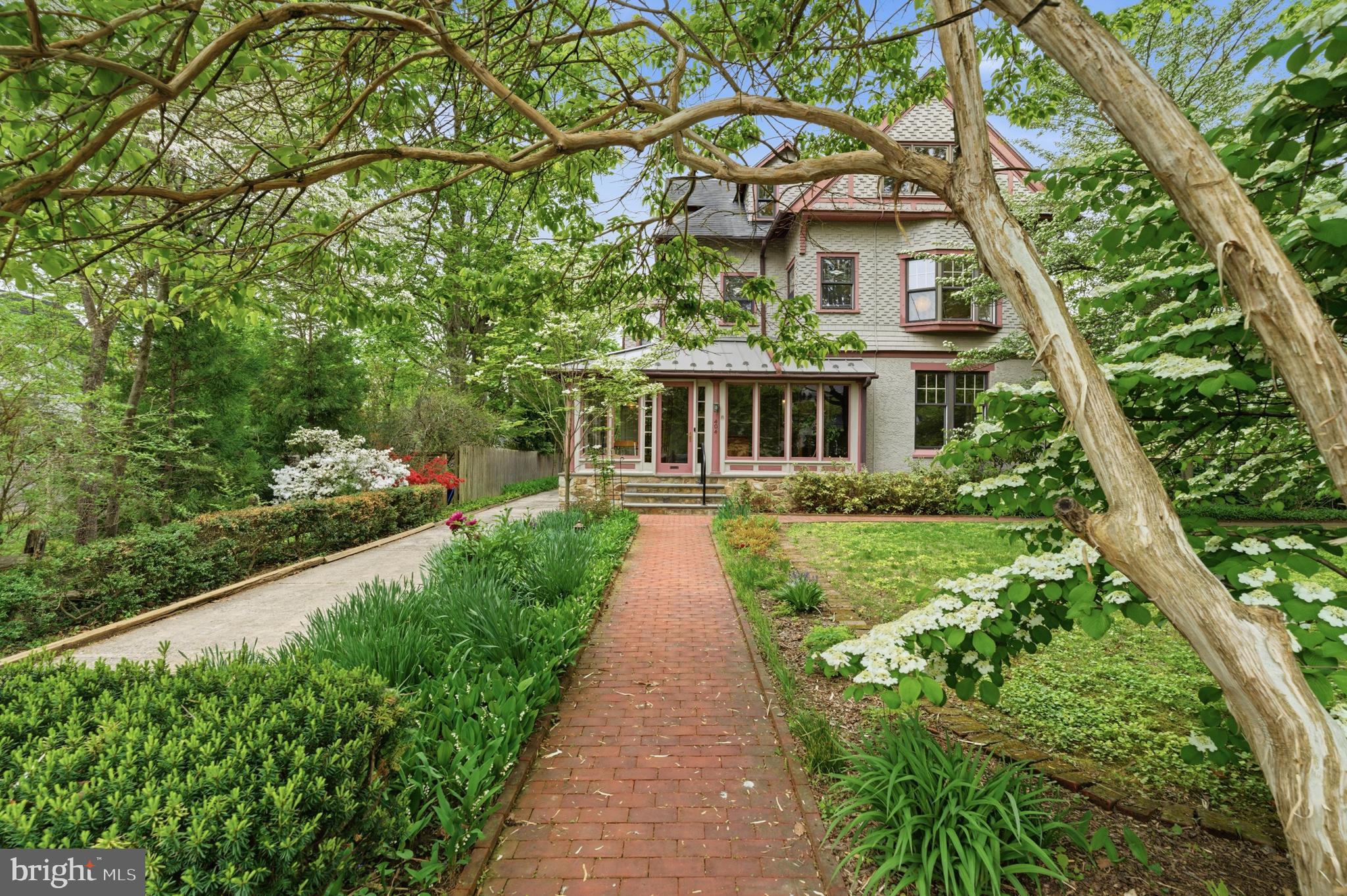 A legacy home in one of the best locations in North Wayne.  Welcome to 404 Oak Ln, offering 6 bedrooms, 4 full baths, exceptional square footage and versatility in the 3 story floor plan, set on a nearly half acre level lot in the heart of it all!  This home has been loved by the same family for decades.  The storybook setting has been built over time to include mature foundational landscape, a native plant prairie garden, a gorgeous pool which is perfectly located on the lot (so you’ll still have a huge backyard), oversized attached garage and long private drive.  Enter at the front wrap around porch, a space you can enjoy 3 seasons a year.  The main level of the home has rich Victorian details to include oak hardwood floors, a stunning staircase, gorgeous fireplace and original molding details.  The ceiling height is wonderful and each room flows beautifully into the next starting at the foyer entry.  The scale of the rooms are grand and the dining room is a wonderful space for entertaining.  The country kitchen includes a walk-in pantry, large mudroom/laundry room space, an original oak built in, white shaker cabinetry and access to the back staircase for convenience.  The mudroom has a full bathroom which offers convenience for pool goers.  Upstairs on the 2nd floor you’ll find 4+ bedrooms and 2 full baths.  Stunning tile in pristine condition in the hall bath and a renovated bathroom in the back bedroom with a glass surround shower.  Enjoy gorgeous views of the property from the 2nd floor porch.  The size of bedrooms are large and reconfiguration for your needs is possible.  Up on the 3rd floor there are 2 additional bedrooms and an amazing walk-in closet room with original builtins.  The basement of the home is unfinished and large for storage.  From the moment you pull down the street, you are surrounded by other stunning homes, rich in history, all unique, with gorgeous landscapes.   The home has gorgeous gingerbread details, classic for its era.  You’ll love the far setback off of the street and will be blown away by the size of the back and side yards as well.  This home offers an amazing opportunity to reside in one of the most sought after walk-to Wayne locations, a chance to customize a home to fit your needs and create something that will last a lifetime.