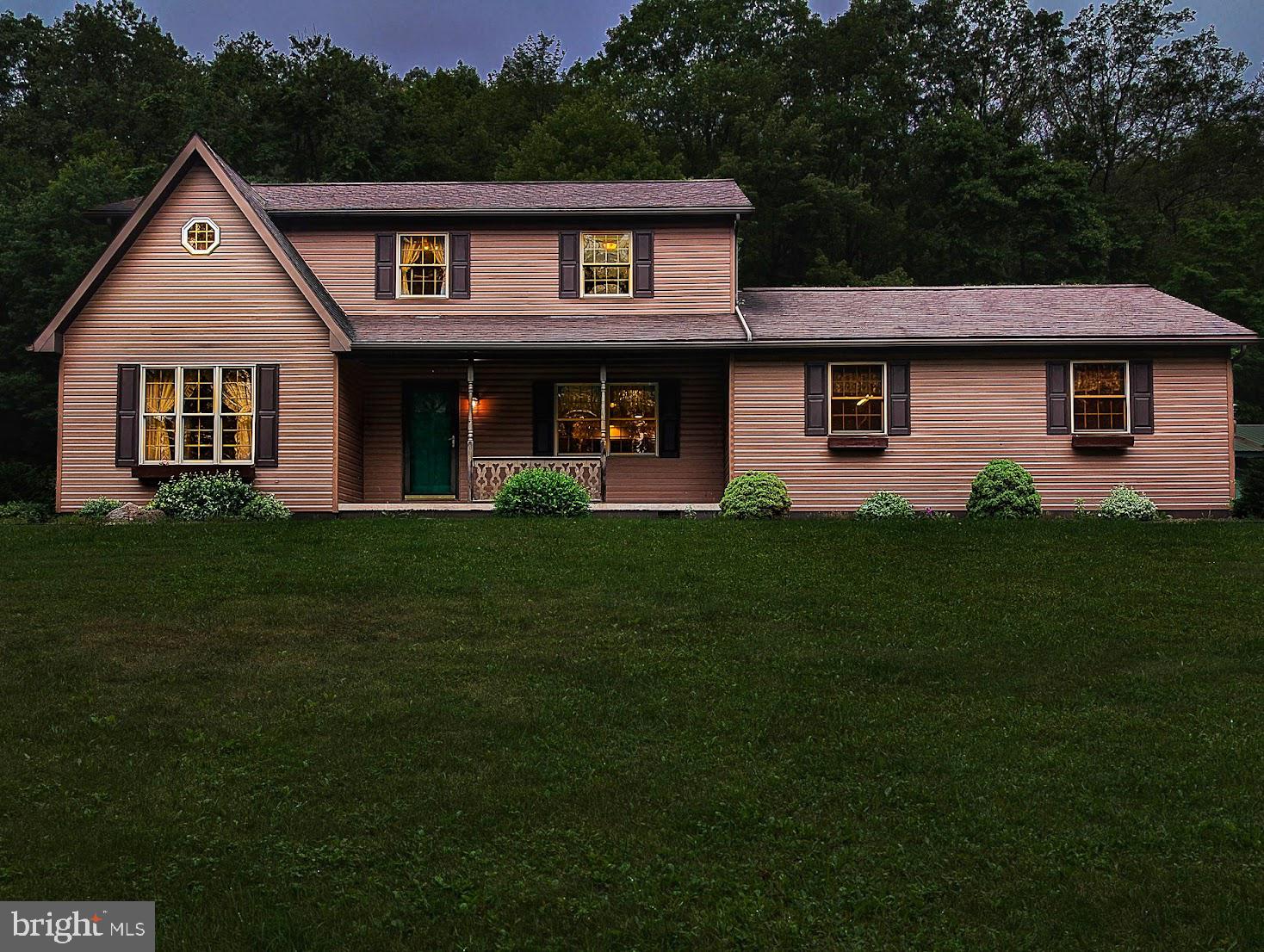 Looking for the kind of place you never want to leave? This extraordinary 160-acre property offers the perfect blend of natural beauty, total privacy, and a well-built home that's ready for whatever lifestyle you're dreaming of—whether it's homesteading, hunting, weekend retreats, or full-time country living.

Tucked far from the road, the custom-built 4-bedroom, 2.5-bath home was designed for comfort and longevity. Built by Bill Waltman in 1998, it features superior walls in the basement, heated, newer hot water heater, outdoor wood furnace, baseboard oil heat, and a whole-house water filter. The outdoor furnace will heat all 3 zones of the house as well as heat the hot water for the house.  There's an enclosed sunporch for quiet mornings, central vac for convenience, and even a root cellar under the porch for your homegrown harvest. Upstairs, a bonus office space is already plumbed and could easily become a second upstairs full bath.  All bedrooms have walk in closets.

The land is where this property truly shines—160 acres of pure Pennsylvania wilderness with some timber value, trails for ATVs or hiking, and two large pole buildings (electric to both, and large overhead storage in one of them) ready for your equipment, toys, or business needs. A newer well pump ensures reliable water, as well as a second well on the property and the peaceful setting ensures you'll hear more birds than cars.

Property is located minutes away from Pennsylvania State Game Lands offering miles of public hunting, fishing, and wildlife watching terrain.  Winter sports are within reach with Blue Knob Resort around 30 minutes away, ideal for skiing or snowboarding getaways.  Be at Shawnee Lake within minutes.  

This is more than a home. It's peace. It's a place to put down roots and live the way you've always wanted—with space to breathe, room to grow, and the kind of privacy you can't put a price on.