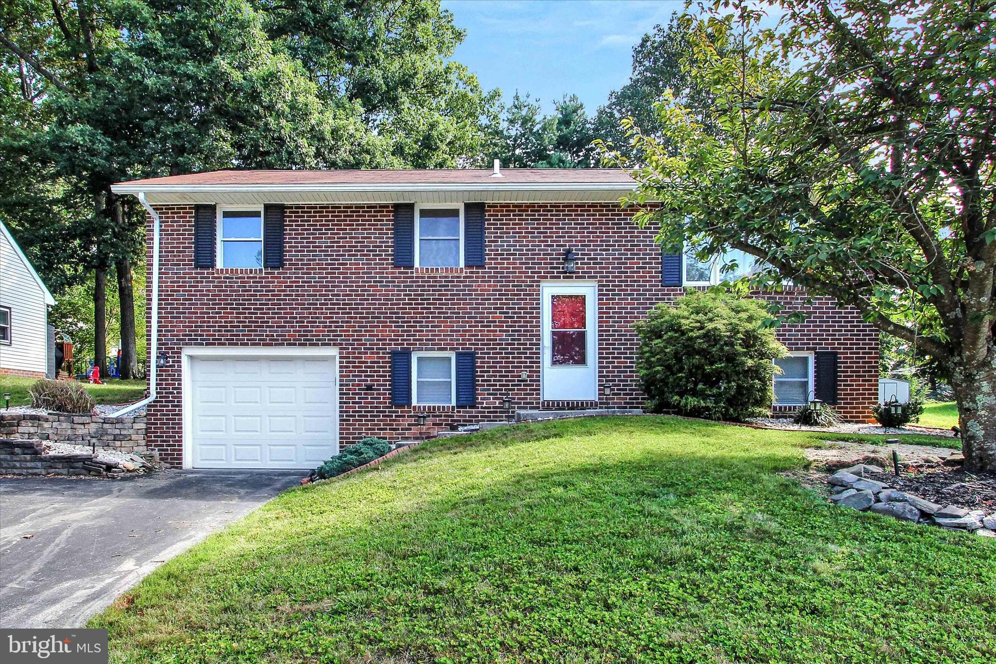 Move right in and unpack! Completely renovated in 2017!! This 3 bedroom split-foyer located in the Penn Village community will IMPRESS! Inside boasts neutral colors, an ample living area, separate dining space within the kitchen and a STUNNING den. This room gleams with natural sunlight provided by the wraparound windows and vaulted ceilings. Entertaining family and friends is a chefs dream in this home. Conveniently off the kitchen and den areas, situated out back, are the deck and patio....where weekends are made for!! Such a great open space to entertain or just relax at the end of your day. Upper level offers three ample sized bedrooms and a full bath. The finished lower level boasts a spacious family room complete with cozy fireplace and a second full bath.  Come see all this property has to offer and schedule your private showing......NOW!