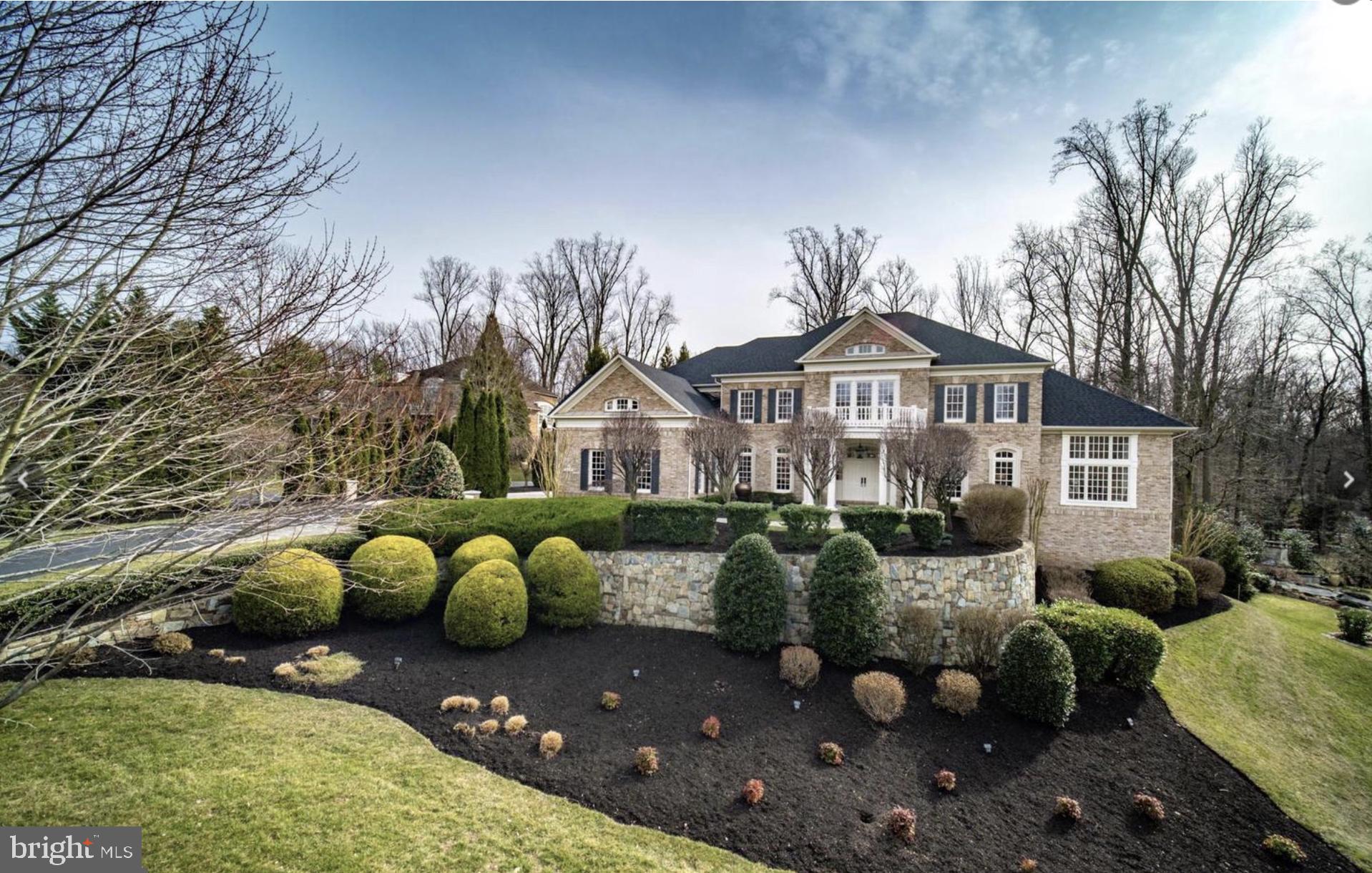 Welcome to 7845 Montvale Way — a rare and elegant estate nestled on nearly an acre in one of McLean’s most exclusive neighborhoods, The Reserve. This stately brick and stone residence spans approximately 10,400 square feet of meticulously designed living space and blends timeless architecture with modern luxury in a truly move-in ready offering. Inside, a grand reception hall sets the tone with soaring ceilings, dark-stained hardwood floors, and sun-drenched formal and informal spaces. The reimagined chef’s kitchen is the heart of the home, featuring integrated Sub-Zero refrigerator and freezer, Wolf cooking appliances, a Zephyr ceiling-mounted hood, and a 7-person quartz island — all opening seamlessly to the family room and breakfast area. Upstairs, the luxurious primary suite offers a serene retreat with dual walk-in closets and a spa-inspired bath. Each of the six bedrooms features its own ensuite bath, all designed with modern, high-end materials and spa-like finishes. The walk-out lower level is a showstopper, offering a second full kitchen with Fisher & Paykel appliances, a 12-foot quartz waterfall island, custom UHD theater, and open-concept living perfect for an in-law suite or extended entertaining. Outdoors, enjoy panoramic front and backyard vistas with flagstone hardscaping, flowing water features, a separate dining deck with built-in grill, a lighted gazebo, and smart exterior lighting systems that create a striking evening presence. A whole-house Kohler gas generator and designer fixtures throughout add to the home's thoughtful upgrades. The Reserve also benefits from 24-hour patrolling security. This is not just a residence — it’s a statement of sophistication and lifestyle.