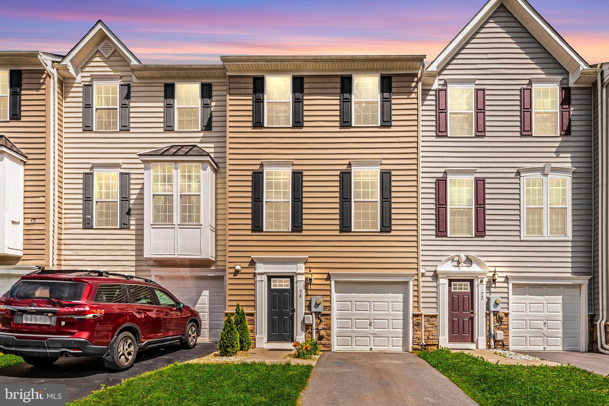 Welcome to convenience and comfort in the heart of Spring Mills! Nestled in one of the area's most commuter-friendly neighborhoods, this impeccable 3-bedroom, 2.5-bathroom townhome is a true gem. Upon entering, you'll be greeted by an inviting foyer adorned with ceramic tile flooring, setting the tone for elegance and functionality. The first level boasts a convenient powder room, inside access to your one-car garage, and a spacious recreation room, perfect for gatherings and entertainment. Ascend to the main level and discover the kitchen, featuring hardwood floors, granite countertops, stainless steel appliances, and a stunning ceramic tile backsplash. The open-concept layout seamlessly connects the kitchen to the expansive living area, illuminated by natural light pouring in through large windows. Enjoy the comfort of the living room equipped with a ceiling fan. The upper level is dedicated to relaxation and tranquility, with the primary suite offering a haven of comfort. Complete with a ceiling fan, walk-in closet, and luxurious en-suite bathroom featuring ceramic tile flooring, dual vanity with granite tops, and a dual-head Roman shower with tile surround. Two additional bedrooms, each prewired for ceiling fans, and a hallway bath with ceramic tile flooring and a tub shower complete the upper level. Added convenience comes in the form of upper-level laundry, with a washer and dryer included. Location is paramount, and this property delivers on that front, offering easy access to major highways I-81 and I-70. Explore a lifestyle of convenience with proximity to dining, medical facilities, shopping, restaurants, and top-notch schools. Don't miss the opportunity to make this your new home sweet home. Schedule your showing today and discover the perfect blend of comfort, convenience, and style!