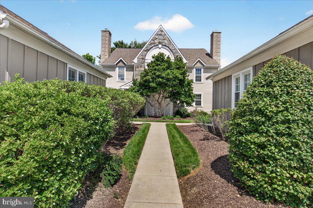 Beautifully Maintained Wormald Built Villa with a Single Family Home feeling in Sought-After Worman’s Mill - Tucked away in a peaceful cul-de-sac, this beautifully maintained 2,737 sq. ft. townhome combines comfort, style, and convenience in one of Frederick’s most desirable communities—Worman’s Mill. Known for its thoughtfully designed setting and strong sense of community, Worman’s Mill offers exceptional amenities including a clubhouse, multiple pools, tennis and pickleball courts, walking and biking trails, and a lively Village Square with shops, restaurants, and regular events.  This three-level, move-in ready home features a 1-car detached garage and stunning exterior landscaping that enhances its curb appeal. Step onto the inviting front porch and into a sun-filled interior with fresh paint throughout. The main level showcases a lovely sunken living room with a gas fireplace, a formal dining room, a half bath, and an updated kitchen featuring granite countertops, stainless steel appliances, and a breakfast area that flows into the family room. Gleaming hardwood floors run throughout the main level (except in the living room, bathroom, and kitchen).   A screened-in porch off the kitchen provides the perfect spot to enjoy morning coffee or unwind in the evening, while the tree-lined, private backyard creates a wonderful space for outdoor entertaining.   Upstairs, the spacious primary suite offers a sitting area, abundant natural light, an ensuite bath with a soaking tub, separate shower, and dual vanities. The laundry area with washer/dryer is conveniently located on this level. The second bedroom is roomy and features a flexible bonus space ideal for a home office or reading nook, plus a full bath.  The finished lower level includes drywall and paint—ready for your choice of flooring—and offers a recreation room, an office or workout area, a utility room, and additional storage space.  Enjoy a low-maintenance lifestyle with HOA services that include lawn care and snow removal (even your sidewalk up to the unit!). Located just minutes from Downtown Frederick and major commuter routes (15, 270, and 70), this home offers the perfect combination of tranquility and convenience, along with access to the unique lifestyle that makes Worman’s Mill one of the area’s most sought-after communities.