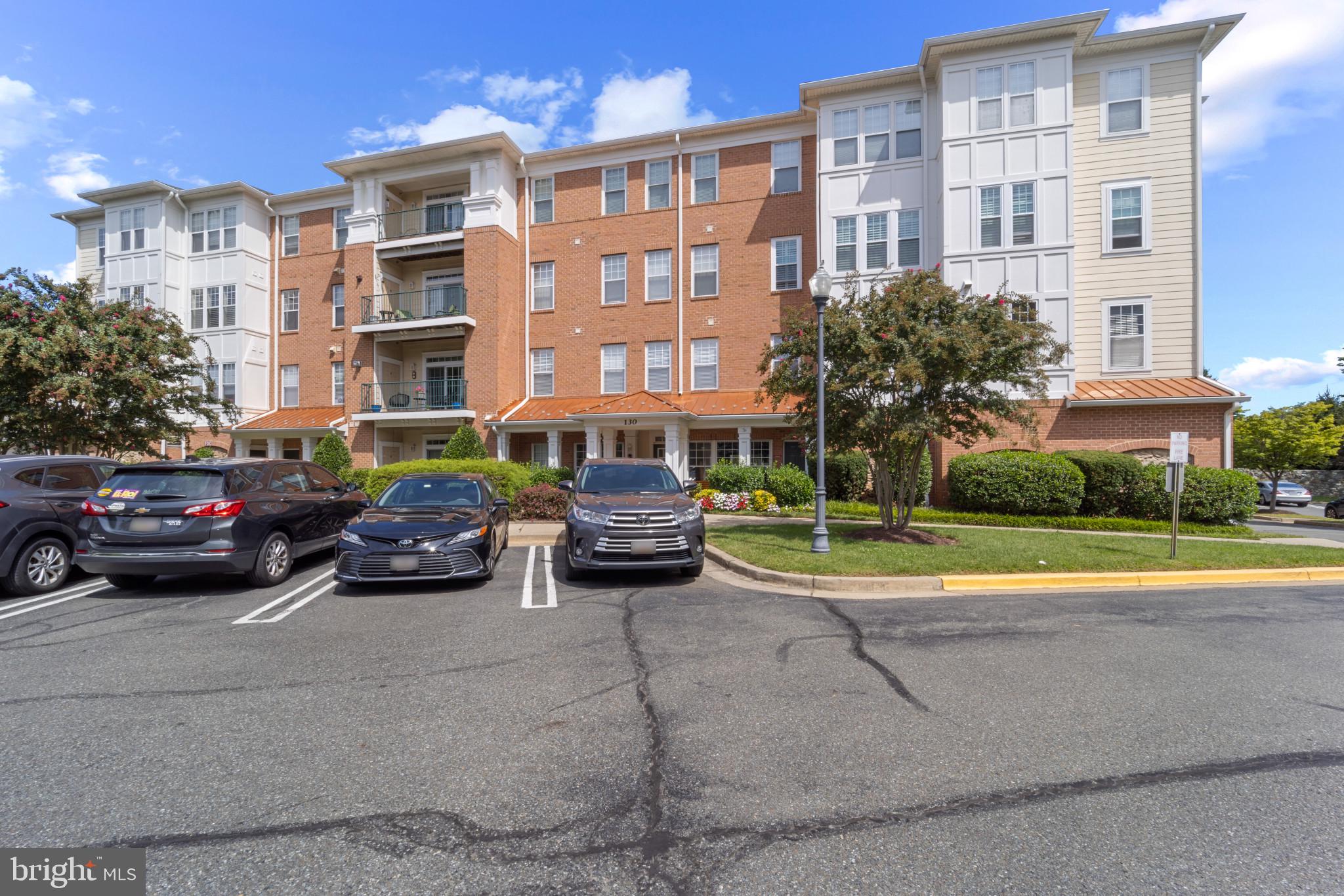 Spacious 2 bedrooms & 2 full baths condo. Brand new carpets, freshly painted, updated kitchen with brand new stand steel refrigerator w/ice maker & stove/range six months old both. Ceiling fan in main bedroom. Located less than 10 feet from the elevator & stairways.  Separate dining room. Spacious living area with sliding glass door into balcony overlooking trees & green area. Separate laundry room w/washer & dryer in unit with extra cabinets for storage.   Plenty off street parking in the circular parking area next to the building.  Storage units separatly deeded conveyed with the condo.  Great location close to countless shopping,  dining and entertainment options. Access to all Kentland amenities.  Great outdoor spaces, trails, community pools & Club House with excercise room. Must see.