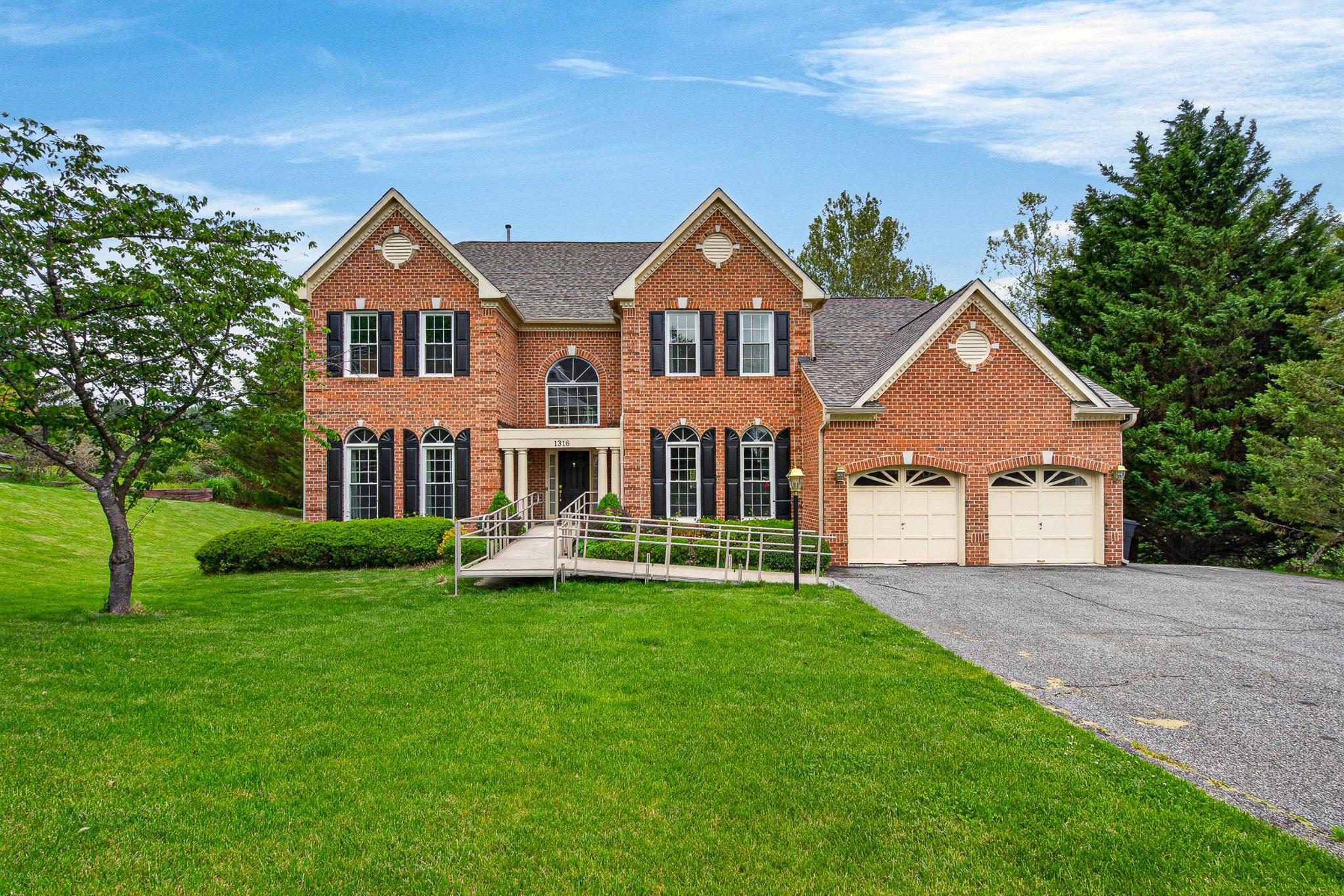 Welcome to this stunning home nestled in one of Baltimore County's most sought-after neighborhoods! From the moment you step inside, a dramatic two-story foyer sets the tone for the spacious, open-concept living that flows throughout the main level, ideal for both everyday living and entertaining. The main level features two bedrooms, offering exceptional flexibility for guests, accessible living, or a convenient home office. Designed with accessibility in mind, with an entry ramp, stall/walk-in showers, and a chairlift to the walk-out basement, this home is a rare and welcoming find for buyers seeking an inclusive, barrier-free living experience. The beautifully updated kitchen is the heart of the home, while the updated primary bathroom offers a private retreat you'll look forward to every day. Upstairs, a charming catwalk connects three generously sized bedrooms and a versatile second-floor landing area, perfect for a reading nook, play area, or lounge space. With five bedrooms across two levels, this home has space for everyone! The large, partially finished basement adds even more living space, including an additional room and full bathroom. Whether you envision a rec room, media lounge, gym, hobby space, or a separate living unit, the possibilities are wide open. With possibilities comes peace of mind, as this home boasts a brand-new roof, new HVAC system, new hot water heater, new kitchen and laundry appliances, new hardwood floors in the main level bedrooms, and new windows, which means the big-ticket items are already done. In the past year, this home has, also, been thoughtfully converted from gas to fully electric utilities. Out back, a spacious yard backs up to trees and a tranquil creek. Your own private slice of nature!  Location is everything, and this home delivers! You're just 15 minutes from Baltimore, with easy access to Johns Hopkins Medical Center, and minutes from premier shopping and dining at Towson and Hunt Valley Town Centers. This is the complete package: space, accessibility, updates, nature, and convenience all in one!