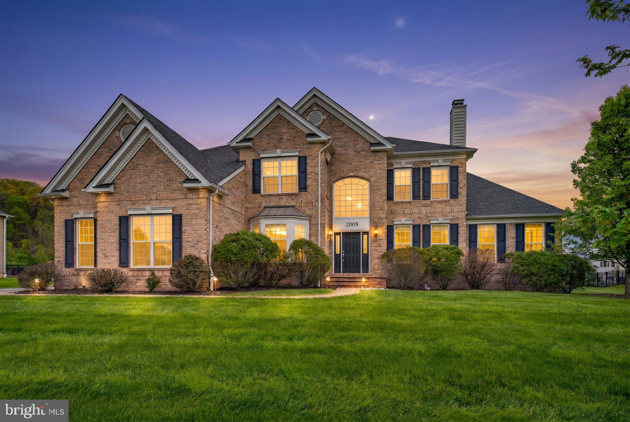 Rare opportunity to own this pristine Toll Brothers home in the highly sought-after Weyhill Estates in Upper Saucon, offering a first-floor in-law suite, finished basement, and 3-car garage equipped with a Tesla wall connector. Set against the privacy of a serene basin, this home provides a peaceful and secluded setting rarely found. Located in the Southern Lehigh School District, it is sure to impress. Boasting 6 bedrooms and 5.5 baths, this home is perfectly suited for grand entertaining and multi-generational living, highlighted by a desirable first-floor private guest suite ideal for visitors, extended stays, or independent living arrangements. A dramatic two-story foyer with a sweeping staircase sets the tone, while hardwood flooring and sophisticated architectural details flow throughout the interior. The gourmet chef’s kitchen is the heart of the home, featuring a Wolf range with double ovens, a Jenn-Air microwave combination wall oven, a Sub-Zero refrigerator, abundant cabinetry, and an oversized center island, all opening seamlessly to the sunlit breakfast area. The kitchen overlooks the impressive two-story great room with a floor-to-ceiling ledgestone fireplace and wall of windows. A convenient rear staircase provides direct access from the family room to the second level. The formal living room offers an additional gathering space, complete with a second gas fireplace for added warmth and sophistication. Thoughtful upgrades throughout include custom closet organizers and remote-control window treatments, enhancing both convenience and everyday luxury. Upstairs, the luxurious primary suite is a true retreat with a spa-inspired bath and an expansive walk-in closet. Spacious secondary bedrooms, including private en-suite accommodations, provide comfort and privacy for family and guests alike. The finished basement offers exceptional versatility, ideal for recreation, media (the media room is already equipped with surround sound), fitness, or additional living space, complete with a bedroom and full bathroom. Two additional unfinished areas provide abundant storage, while offering outstanding potential for future customization or additional finished living space. Outdoor living is equally impressive with a beautifully designed hardscaped patio overlooking the private backyard. With professionally landscaped grounds, refined finishes, and an unbeatable location near Saucon Valley Country Club, Saucon Rail Trail, The Promenade Shops, and major commuter routes, this is luxury living at its finest.