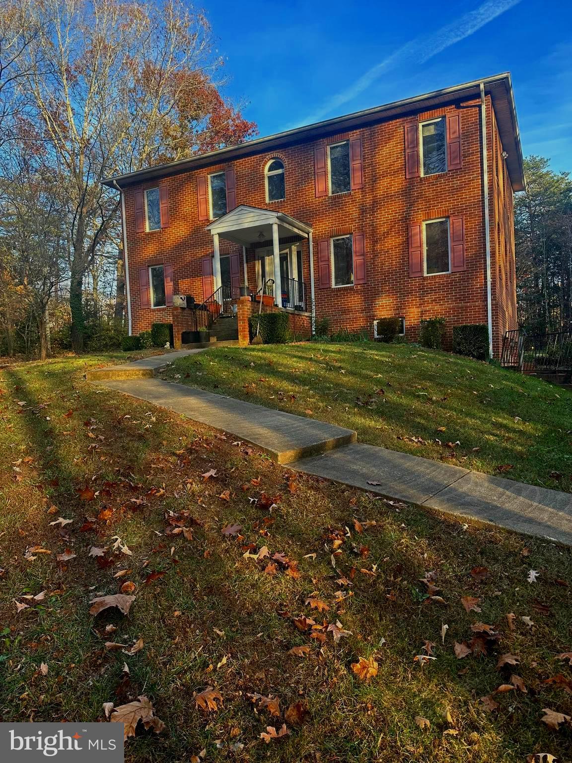 Beautiful 4  bedroom 2,5 bathroom all brick  Colonial on almost 1.5 acres in Nokesville; Furnace is one year old and roof is approximately 3 years old; Large Trex deck, 2 car garage, kitchen with granite countertops, built in bookshelves, laundry chute and hardwood floors are just a few of this  homes features; Septic is approved for 3 Bedroom; 4th Bedroom off primary has a closet and window; Quiet corner lot  with shed that has power running to it and so much more....