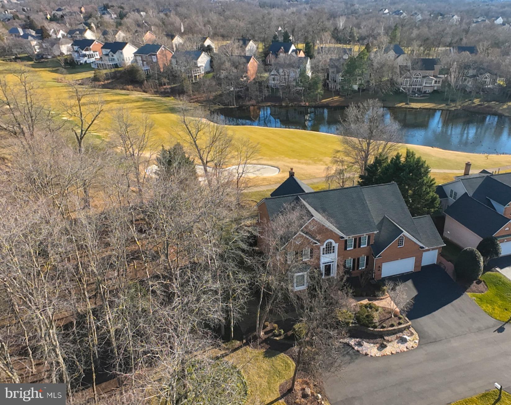 PRICE IMPROVEMENT- now offering exceptional value on this premium River Creek home. OPEN HOUSE: Saturday February 7th 1-3pm! This sophisticated 4-sided brick Colonial offers 7,193 sq. ft. of luxury on a .45 acre cul-de-sac lot with a 3-car garage. Perfectly positioned on River Creek’s 4th hole, you’ll enjoy panoramic tee-to-green views from nearly every room.

Property Highlights:

Chef’s Kitchen: Features a massive granite island, high-end appliances, and a light-filled breakfast area overlooking the fairway.

Indoor-Outdoor Living: A stunning sunroom opens to an expansive deck with a custom pergola—perfect for sunset cocktails or summer hosting.

Primary Retreat: A true sanctuary featuring a sitting room, fireplace, coffered ceiling, and a private wet bar for morning coffee or evening nightcaps.

Entertainer’s Lower Level: Fully finished walk-out basement with a full bar, game room, and fireplace, leading to a spacious covered patio.

Designer Finishes: Brazilian cherry hardwoods, marble and porcelain flooring, and exquisite millwork throughout.

RIVER CREEK LIFESTYLE:
Live the resort life in Leesburg’s premier gated community. Enjoy 24/7 security, a championship golf course, three pools, tennis, pickleball, and a fitness center. Come see the gorgeous clubhouse where you can dine with friends, enjoy the sports bar, meet neighbors at one of the many organized events such as: wine dinners, holiday celebrations, children's pool party or just lounge on the club's patio and enjoy the river view.  Explore 7 miles of trails with your canine friend and the private Confluence Park for kayaking and riverside picnics. 

UNBEATABLE LOCATION:
Just 20 minutes to Dulles Airport and minutes from Wegmans, Costco, and historic downtown Leesburg’s vibrant winery and dining scene.

Turnkey and ready for you!  Schedule your private tour today.  AGENTS- be sure to show your clients the Clubhouse and Confluence Park please.

See VIDEO icon for 3_D Virtual Tour.