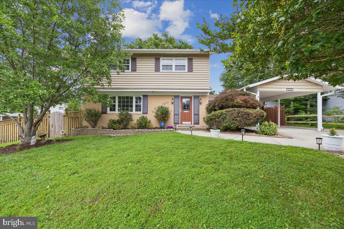 Welcome to this beautifully updated and meticulously maintained Colonial in the highly sought-after Regency Estates community of Potomac! Situated on a beautifully landscaped 0.22-acre lot and just one block from nationally acclaimed Winston Churchill High School, this spacious home offers the perfect blend of timeless elegance, modern updates, and exceptional living space.

The main level features gleaming hardwood floors, a gracious foyer, an oversized living room with a decorative fireplace, a formal dining room with crown molding and chair rail, an updated powder room, and an inviting family room with a cozy gas fireplace, luxury vinyl flooring, and French doors leading to the expansive deck and backyard. The updated eat-in kitchen is the heart of the home, featuring cherry cabinetry, granite countertops, ceramic tile backsplash, stainless steel sink, bay window breakfast area, pantry room, Maytag double oven, Bosch dishwasher, gas cooktop, and abundant storage.

Upstairs you'll find four generously sized bedrooms with hardwood floors throughout. The spacious primary suite offers a walk-in closet with organizers and an en-suite bath. Three additional bedrooms share a well-appointed hall bath. A floored attic with pull-down stairs provides valuable additional storage.

The finished walkout lower level offers tremendous flexibility with an expansive recreation room, full bath, recessed lighting, built-in shelving, exercise room, finished laundry room, and the potential for a fifth bedroom, guest suite, or home office.

Outdoor living is equally impressive with a large deck overlooking the beautifully landscaped, fully fenced backyard featuring brick walkways, mature landscaping, storage shed, and plenty of room for entertaining, gardening, or play.

Numerous updates include replacement windows and doors, updated roof, solar panels, freshly painted interior and exterior, updated electrical outlets and switches, updated trim, hardwood flooring, renovated kitchen, and more. A covered carport, spacious driveway with additional parking, and walk-up basement complete this exceptional property.

Ideally located just minutes to I-270, Metro, shopping, restaurants, parks, and all that Potomac has to offer. This is a rare opportunity to own a move-in ready home in one of Montgomery County's most desirable neighborhoods.