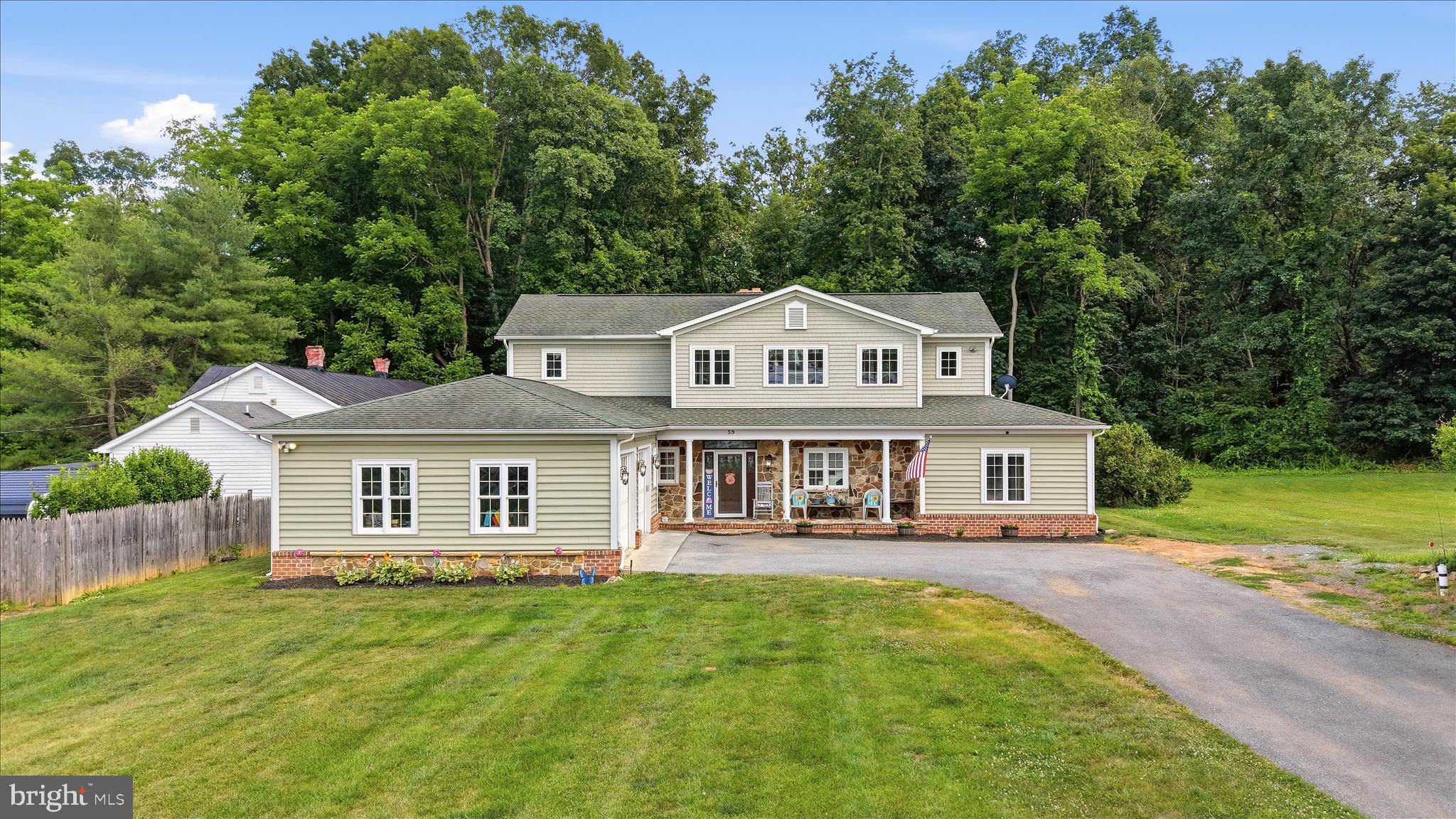 Stunning Colonial in the charming Town of Boyce offering an exceptional blend of luxury, comfort, and privacy. This beautifully appointed home features 4 spacious bedrooms and 4.5 bathrooms, with an open floor plan filled with natural light, gleaming hardwood floors, and recessed lighting throughout. The gourmet kitchen is a chef's dream, showcasing stainless steel appliances, a center island, and a sunny breakfast area perfect for everyday living and entertaining.

Situated on a generous 0.40-acre lot backing to tranquil parkland, the property provides a peaceful setting with a lovely patio and inviting front porch ideal for outdoor gatherings or quiet relaxation. An attached garage and paved driveway offer ample parking and convenience.

Located in the heart of the quaint Town of Boyce, this exceptional home is just moments from local parks, schools, and community amenities, offering the perfect balance of small-town charm and modern convenience. Experience the beauty and serenity of Boyce and discover all that this remarkable property has to offer.