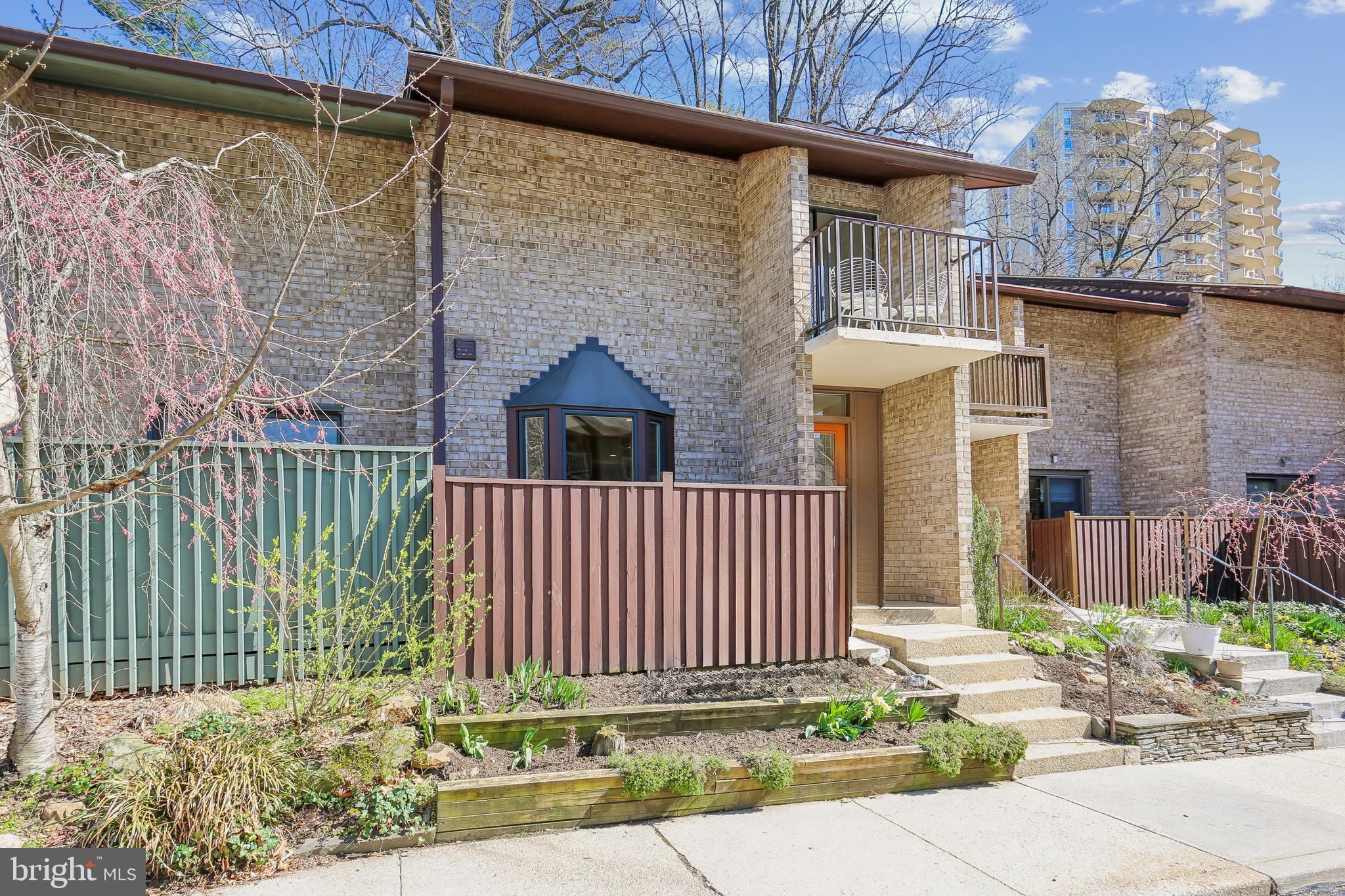 Welcome to 9211 Three Oaks Drive, a thoughtfully maintained contemporary townhome ideally situated next to Sligo Park. The kitchen, renovated in 2017, connects seamlessly to the main living spaces, creating a smooth flow for both everyday living and entertaining. Hardwood flooring was updated the same year, and the living room features custom built-ins added in 2018. Just beyond, the backyard offers a peaceful wooded setting, an inviting spot to relax and unwind. The dining area is enhanced by a raised ceiling with recessed lighting, while skylights installed in 2012 and insulated for efficiency bring in natural light to the heart of the home. Upstairs, all bedrooms include ceiling fans with lighting for added comfort. The primary suite offers a calm retreat, complete with a walk-in closet, private balcony, and a beautifully updated bath completed in 2019. Both the hall bath and powder room have been refreshed with new toilets installed in 2024. The lower level provides flexible additional living space, with tile flooring installed in 2019 and a brand-new washer and dryer. Major system updates include HVAC replaced in 2021, water heater in 2017, a 200-amp electrical heavy-up, roof and sliding door replacement in 2012, and extensive drainage improvements completed in 2015, offering peace of mind for the next owner. Enjoy the convenient neighborhood pool located at the end of the street. With Sligo Park just outside your door, trails, green space, and recreation are always within easy reach. The home is also conveniently located approximately 1.5 miles from the Silver Spring Metro Red Line, about 0.8 miles from the future Purple Line, and about 2 miles from downtown Silver Spring, with quick access to I-495 and Washington, DC.