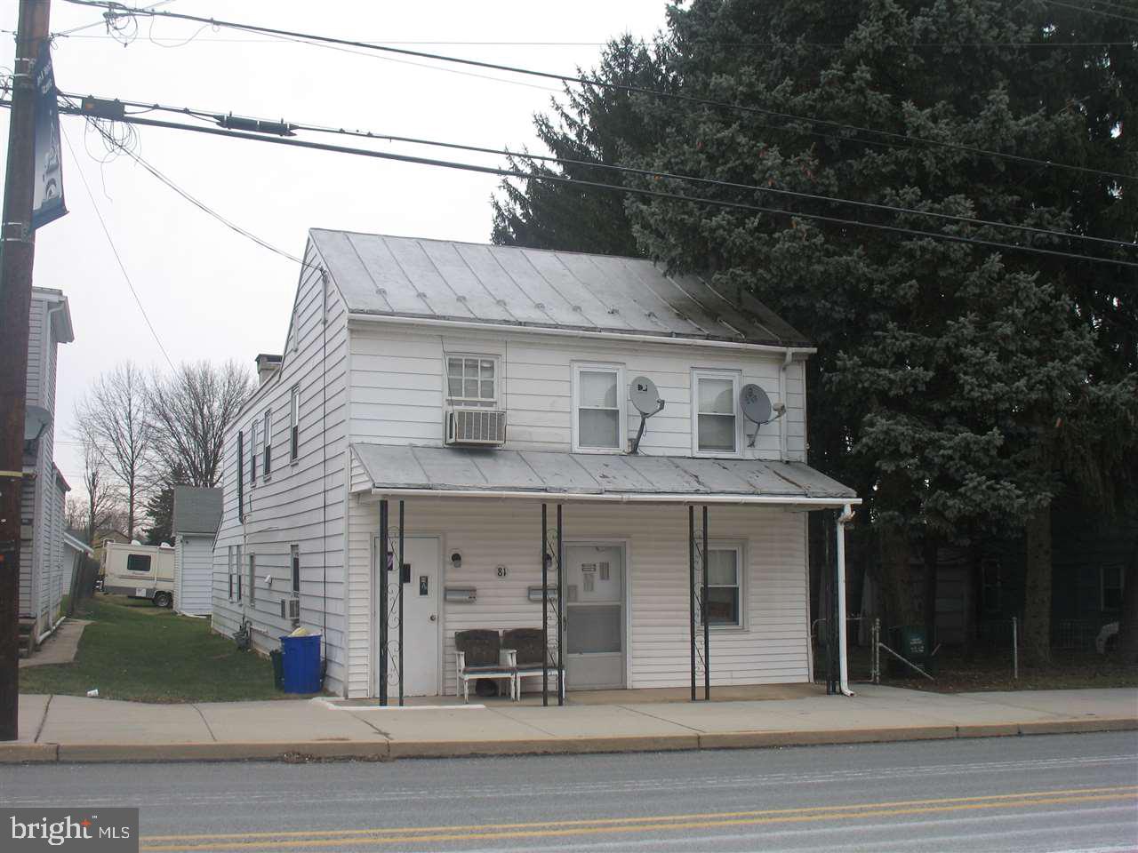 2 Rental Units with separate utilities * Nice side yards * Outstanding income producing investment enhanced by maintenance free parking garages for 8 vehicles or storage units * Rare opportunity for sharp investor*