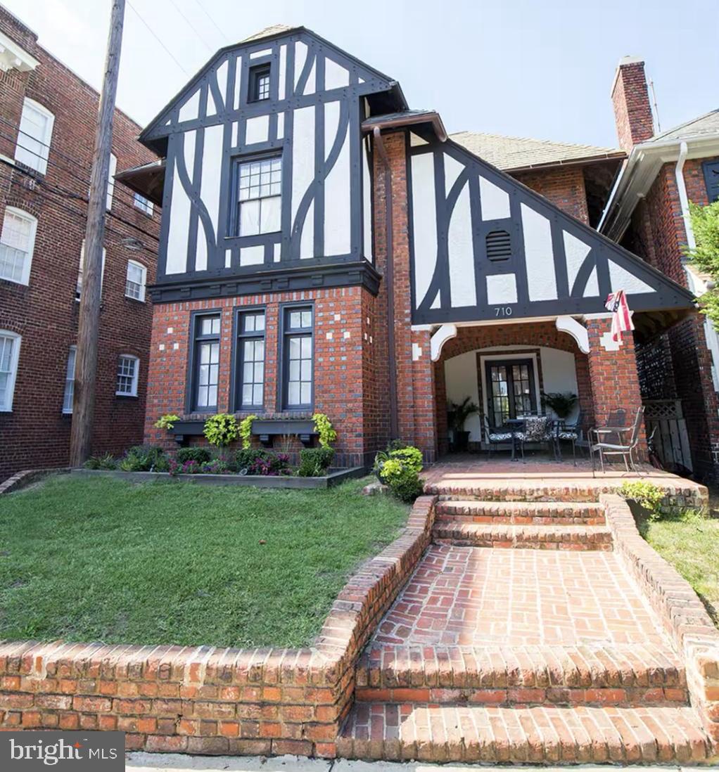 Historic Grand Tudor Home priced below assessed value... Can be sold mostly furnished.  Full basement is flex space or ready for your own improvements as an owners/ caretakers unit. Huge front door (40 in) leading to a grand foyer.