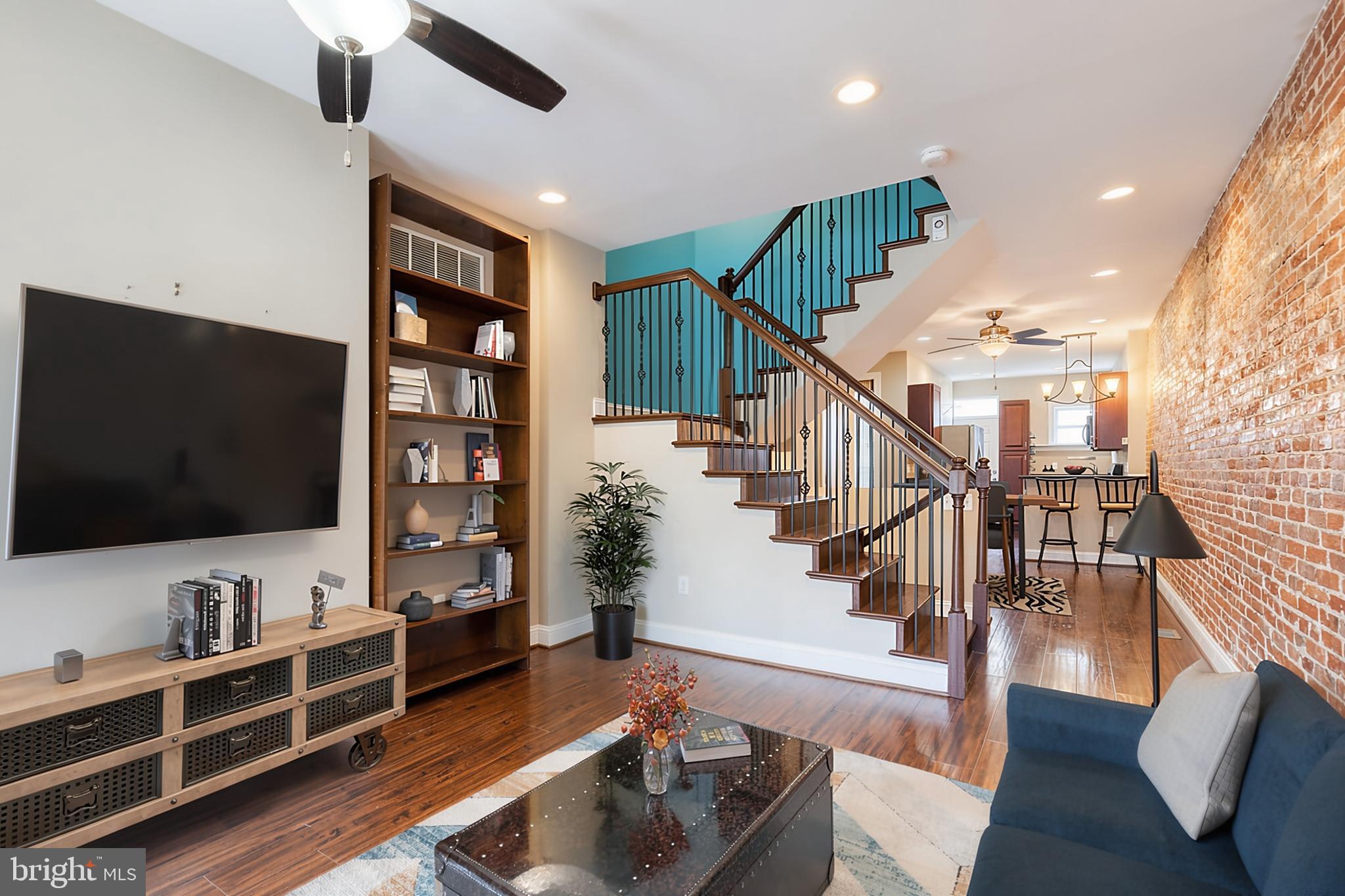 Beautiful 4-story brick rowhome in Upton featuring 3 bedrooms and 2.5 bathrooms with stylish updates throughout. Bright and inviting with engineered wood flooring, exposed brick walls, recessed lighting, ceiling fans, and great closet storage throughout.

The main level offers an open living, dining, and kitchen layout with a convenient half bath. Kitchen includes stainless steel appliances, granite countertops with seating, and adjoining dining area.

First upper level features two bedrooms and a full bath with double vanity and tub/shower. The top level is a private primary suite with a large walk-in closet and en-suite bath with double vanity, soaking tub, and separate shower.

Recent updates: stove (2025), washer (2022), roof & gutters (2020), hot water heater (2020), Pella windows (2020), and waterproofing with sump pump (2020). Convenient location near green space and playground.

This home is eligible for Buying Into Baltimore and other grant programs! Contact listing agent for more information.

Looking for huge savings? A 2/1 interest rate buy down is available at no cost to the buyer! This could result in savings of approximately $280/month in year 1 and $150/month in year 2. Buyer is not obligated to use Brittany Bobbs of CrossCountry Mortgage to have an offer accepted; however must use Brittany Bobbs to qualify for the 2/1 buydown.

 Welcome home!