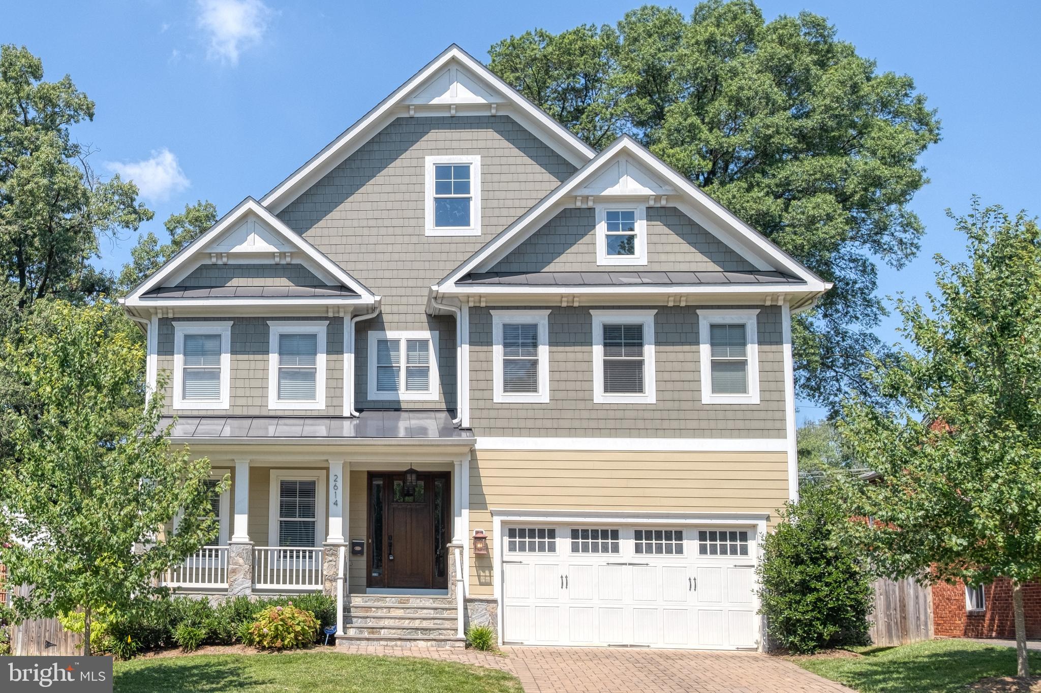 Welcome home to this Gorgeous Craftmark style home with 5 bedroom,  5.5  bathroom and 2 car garage!    The Light filled open floor plan has Hardwood floors throughout main and upper levels and designer lighting.  This home features separate living and dining rooms.   A Great room with coffered ceiling and gas fireplace opens into the kitchen for ez entertaining.  The Gourmet kitchen has an extended island with granite counters, stainless steel appliances, gas stove with attached breakfast area. Wet bar area between dining and kitchen. Separate office/den with custom builti in access from entry or great room. The Mud room off garage with storage cubbies. Expansive master bedroom with large walk in closet. Master ensuite has corner tub, separate shower and dual vanities. 3 additional bedroom suites on upper level each have their own bath.   Walk up Lower level with custom designed media room, rec room, bedroom and bathroom. Private deck for entertaining, fenced backyard and 2 car garage.