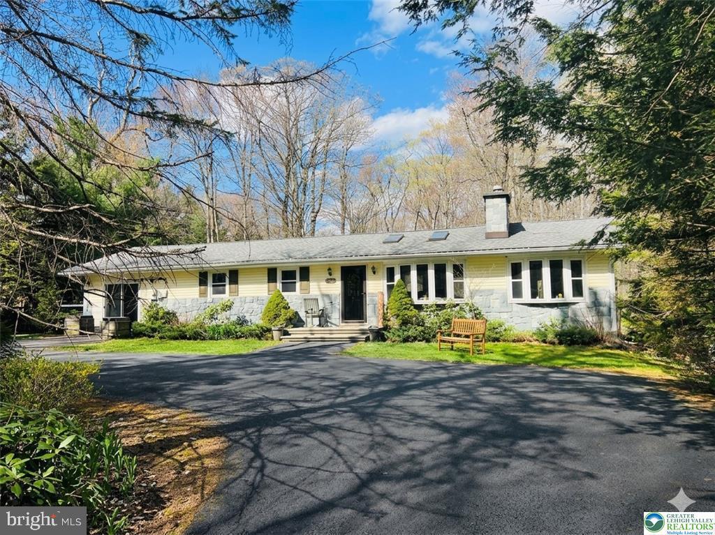 Pristine Pocono Farms Ranch with Dedicated Den/Home Office & Pet-Friendly Yard! Welcome home to this beautiful 3-bedroom, 2-bathroom Ranch nestled in the highly sought-after Pocono Farms Country Club and Golf Community. Designed with modern living in mind, the home boasts a bright, inviting open-concept layout that effortlessly connects your living and entertaining spaces. Cozy up by the fireplace in the spacious living room, or host memorable gatherings in the expansive family and game room. Perfect for remote professionals, the dedicated den serves as an ideal home office, providing a quiet and productive workspace away from the main living areas. The well-appointed kitchen is a chef's delight, complete with modern appliances, ample storage, and a casual breakfast bar that opens to the formal dining room. Slip away to the massive primary suite, featuring a private reading area, a full en-suite bathroom, and its own direct entrance to the back deck. Outside, the fully fenced yard provides a safe haven for your furry family members to run freely. Living here means enjoying a resort-style lifestyle with unparalleled community amenities, including a PGA golf course, a brand-new Olympic-sized pool and splash pad, tennis and basketball courts, a modern gym, a lake, and a vibrant country club restaurant and bar featuring live entertainment. Don't miss your chance to own this private oasis!