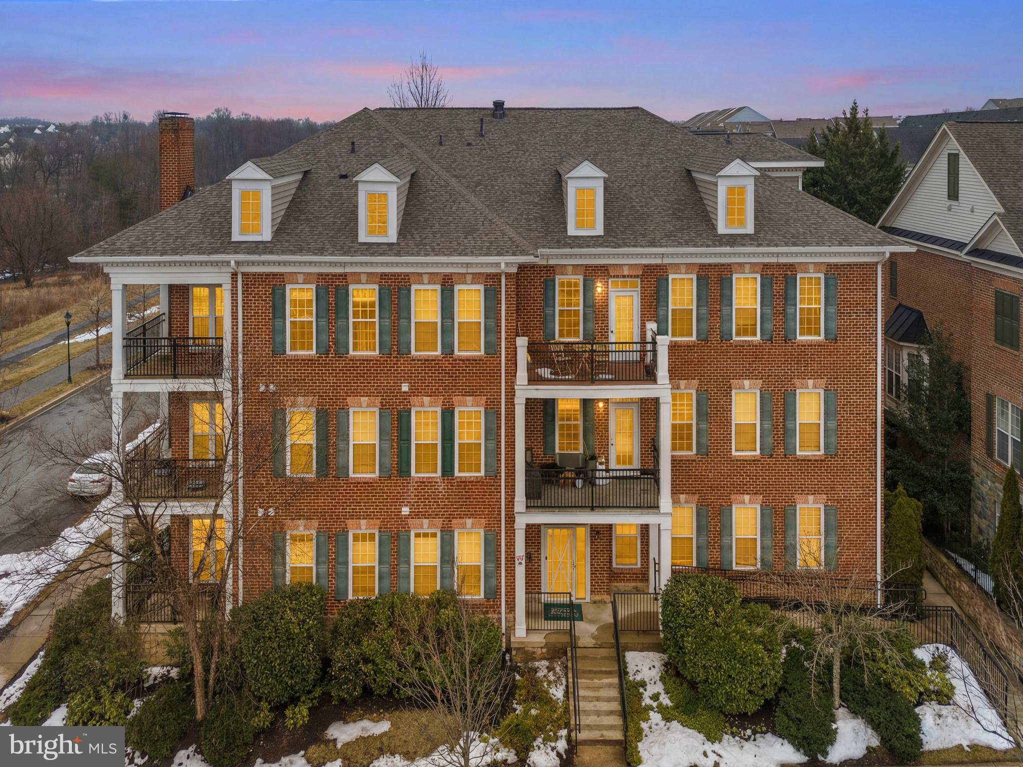 Welcome to this charming brick 2-bedroom, 2-bath condo in the highly sought-after Clarksburg Town Center! Plenty of parking around! This beautifully maintained home offers nearly 1,300 square feet of bright, comfortable living space filled with thoughtful upgrades throughout. From elegant crown molding and chair rail detailing to custom paint, updated flooring (2025), and brand new water heater (2025), every detail has been carefully curated.

The spacious gourmet kitchen features rich 42” cabinetry, granite countertops, stylish stainless steel appliances, gas cooking, a large single-basin sink, built-in microwave, and a peninsula with seating—perfect for casual dining or entertaining. The open-concept living and dining areas are filled with natural light and lead to a private balcony with peaceful views.

Both bedrooms are generously sized, including a spacious primary suite with a walk-in closet and private bath. Additional highlights include ample storage throughout.

Enjoy tons of parking and an unbeatable location just minutes from community amenities, Clarksburg Premium Outlets, restaurants, parks, commuter routes including I-270, and more.

This one truly has it all—style, space, and location. A must-see!